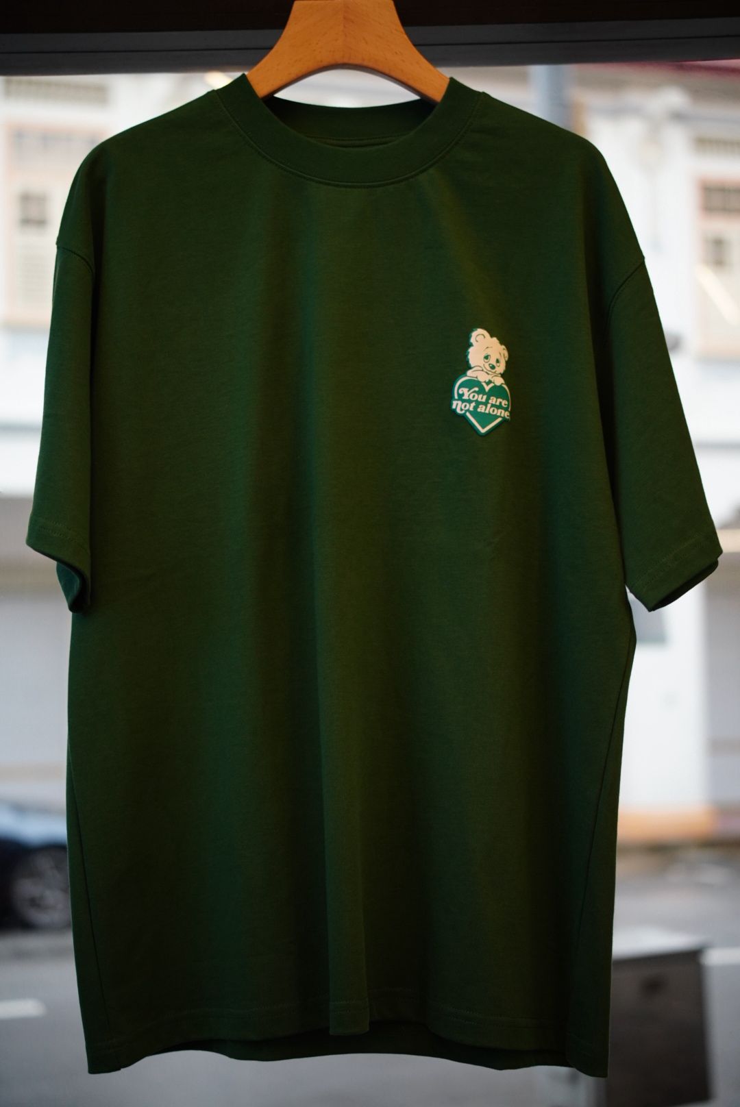 A Eckhaus Latta Shirt pictured on a model in front of a white background. The title of the product is Eckhaus Latta Eclipse Turtleneck - Stone and the image was taken by 199A®.