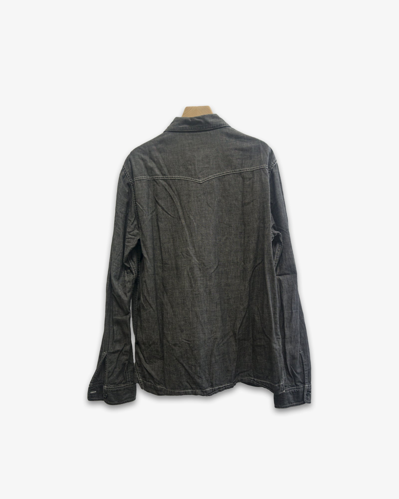 A Eckhaus Latta Shirt pictured on a model in front of a white background. The title of the product is Eckhaus Latta Eclipse Turtleneck - Stone and the image was taken by 199A®.