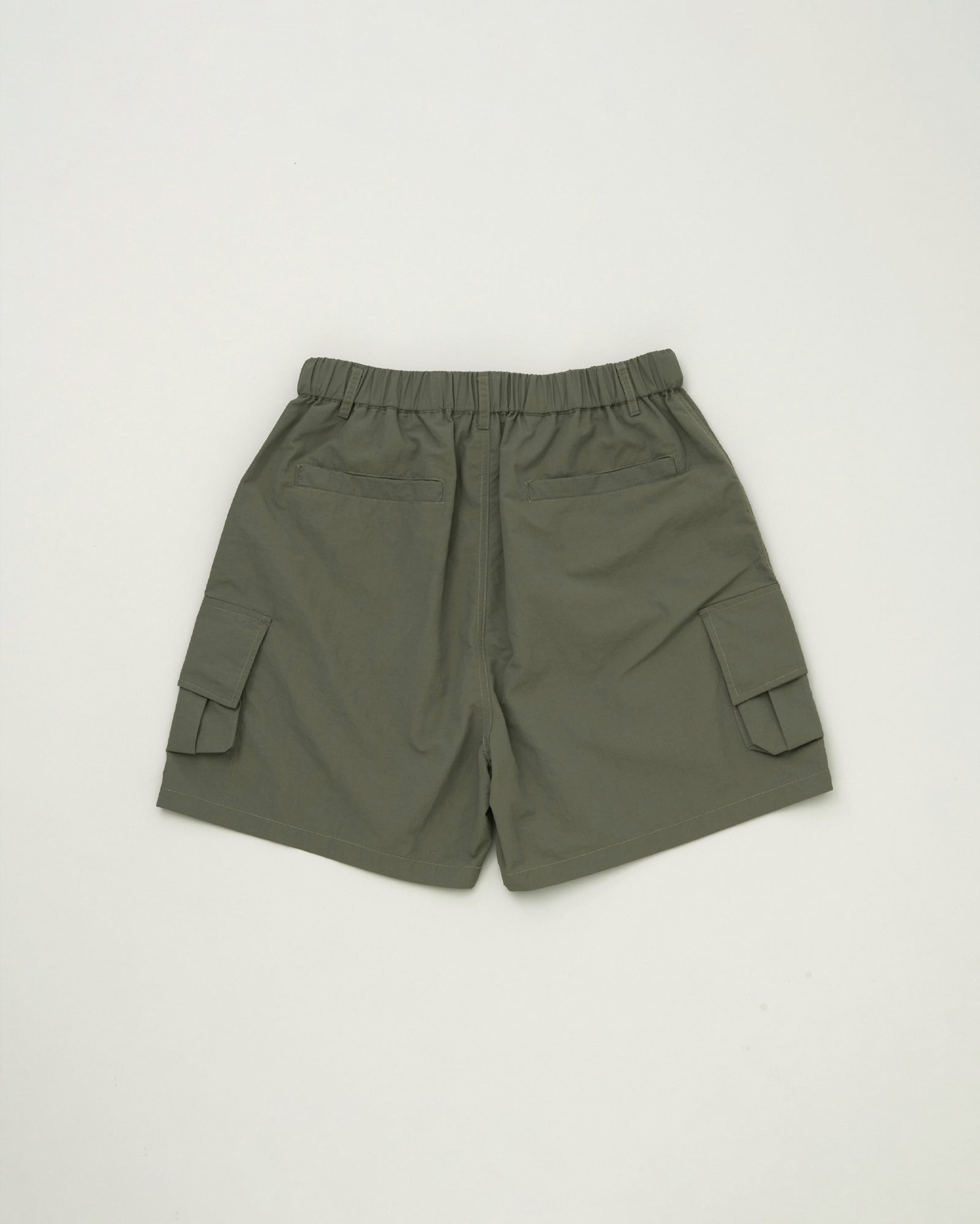 A Eckhaus Latta Shirt pictured on a model in front of a white background. The title of the product is Eckhaus Latta Eclipse Turtleneck - Stone and the image was taken by 199A®.