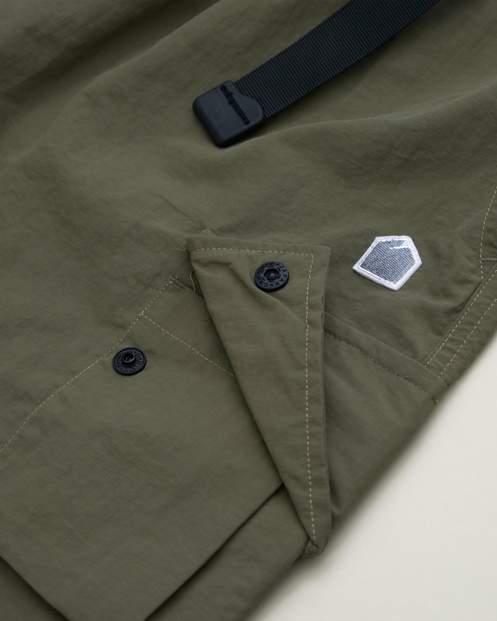 A Eckhaus Latta Shirt pictured on a model in front of a white background. The title of the product is Eckhaus Latta Eclipse Turtleneck - Stone and the image was taken by 199A®.