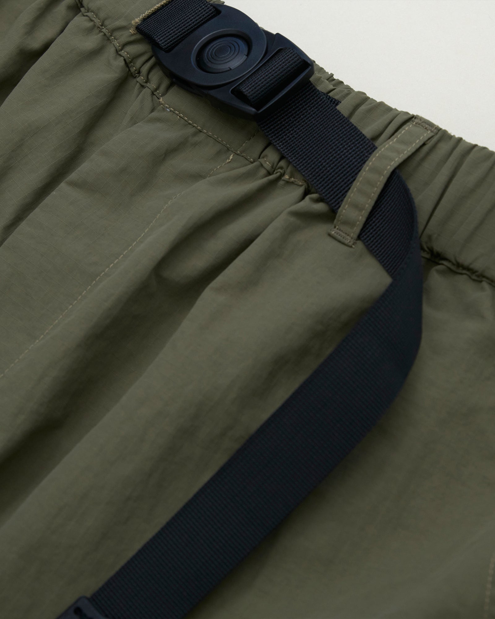 A Eckhaus Latta Shirt pictured on a model in front of a white background. The title of the product is Eckhaus Latta Eclipse Turtleneck - Stone and the image was taken by 199A®.