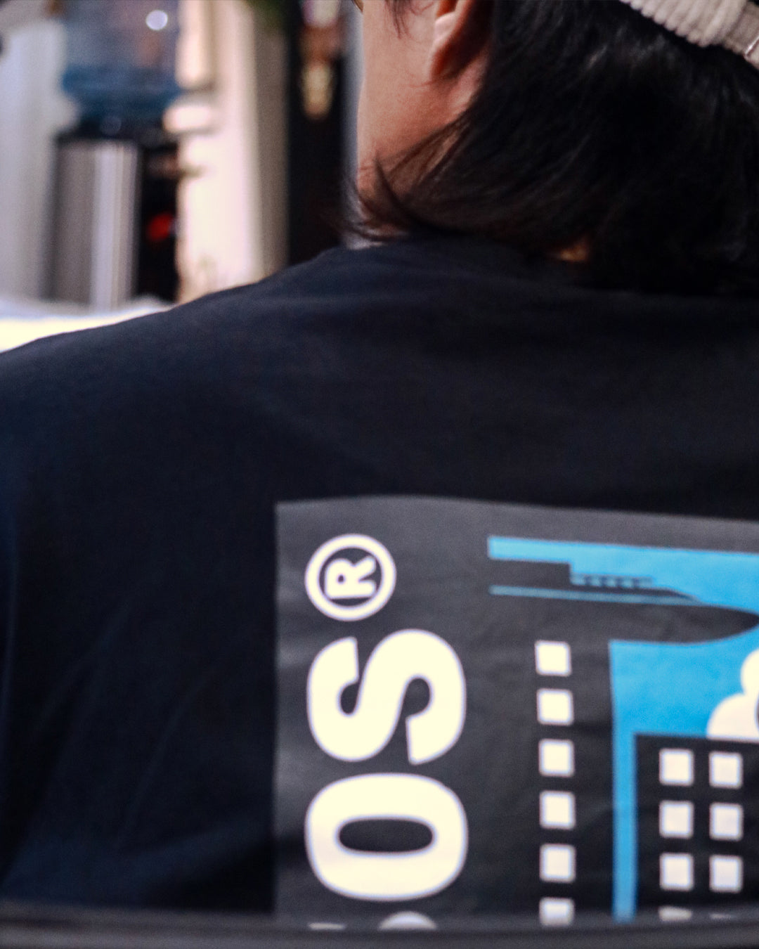 A Eckhaus Latta Shirt pictured on a model in front of a white background. The title of the product is Eckhaus Latta Eclipse Turtleneck - Stone and the image was taken by 199A®.