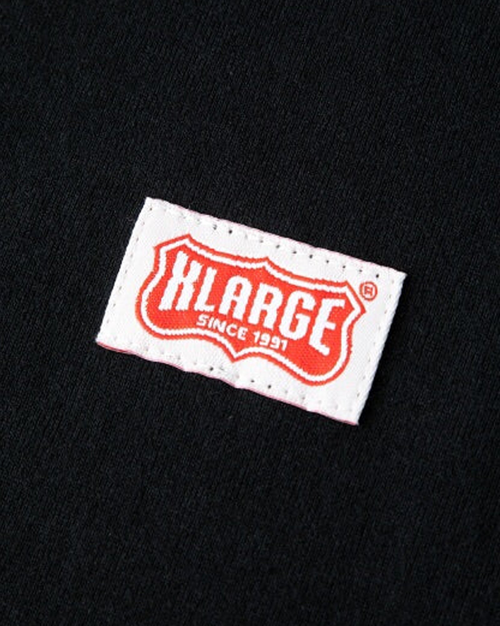 A Eckhaus Latta Shirt pictured on a model in front of a white background. The title of the product is Eckhaus Latta Eclipse Turtleneck - Stone and the image was taken by 199A®.