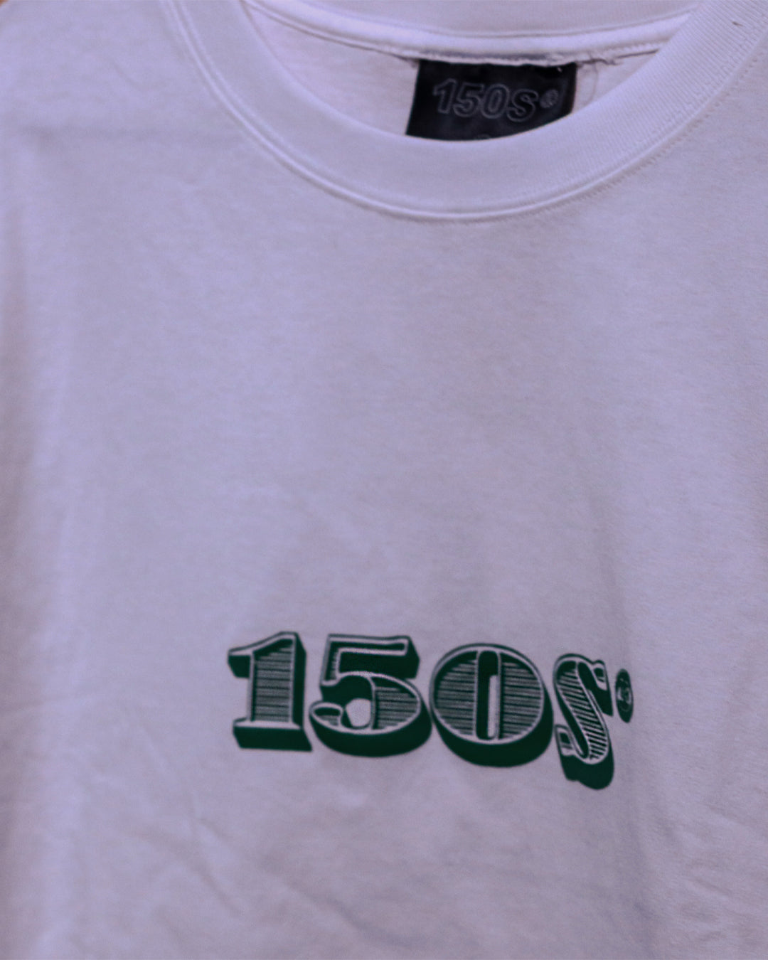 A Eckhaus Latta Shirt pictured on a model in front of a white background. The title of the product is Eckhaus Latta Eclipse Turtleneck - Stone and the image was taken by 199A®.