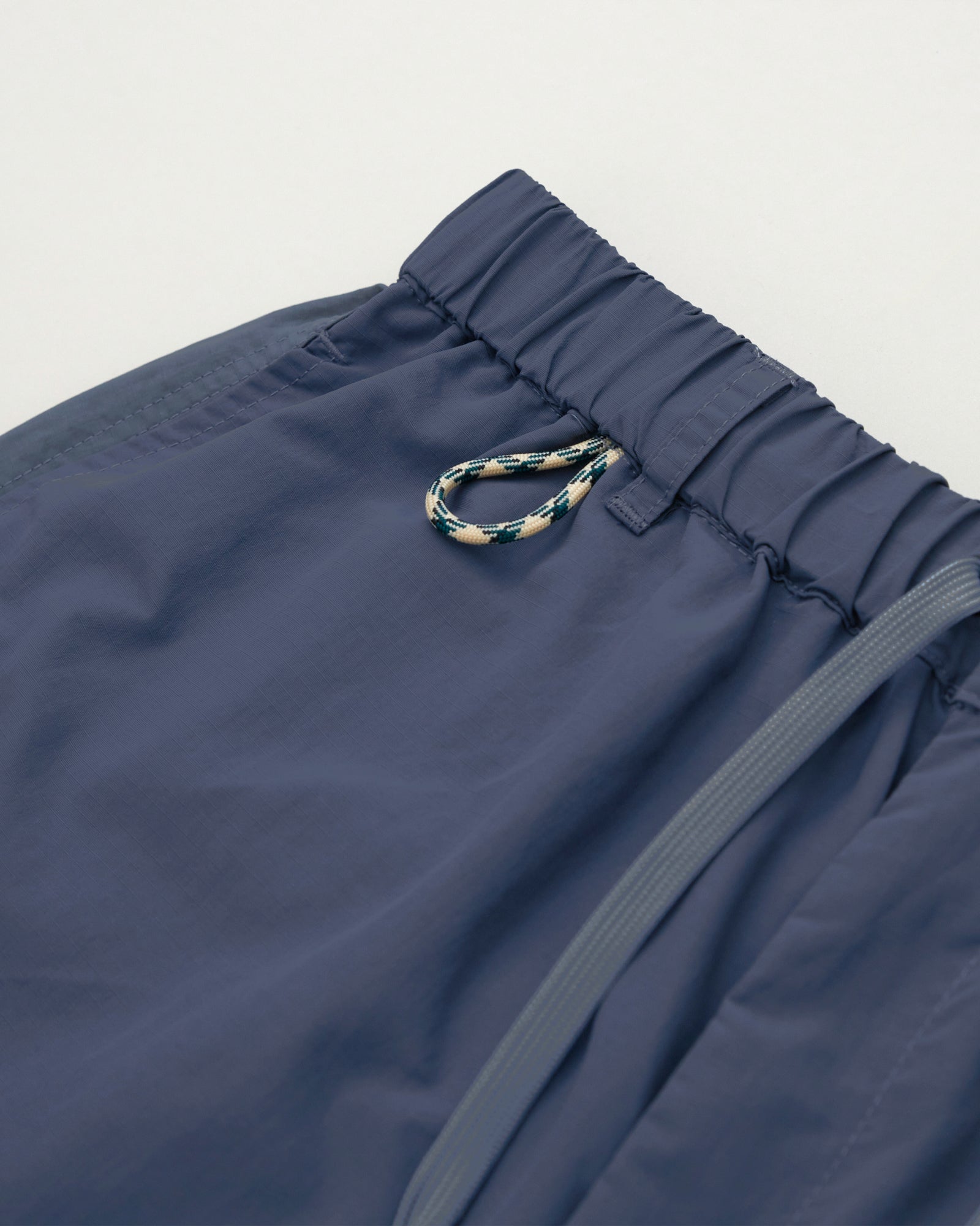 A Eckhaus Latta Shirt pictured on a model in front of a white background. The title of the product is Eckhaus Latta Eclipse Turtleneck - Stone and the image was taken by 199A®.