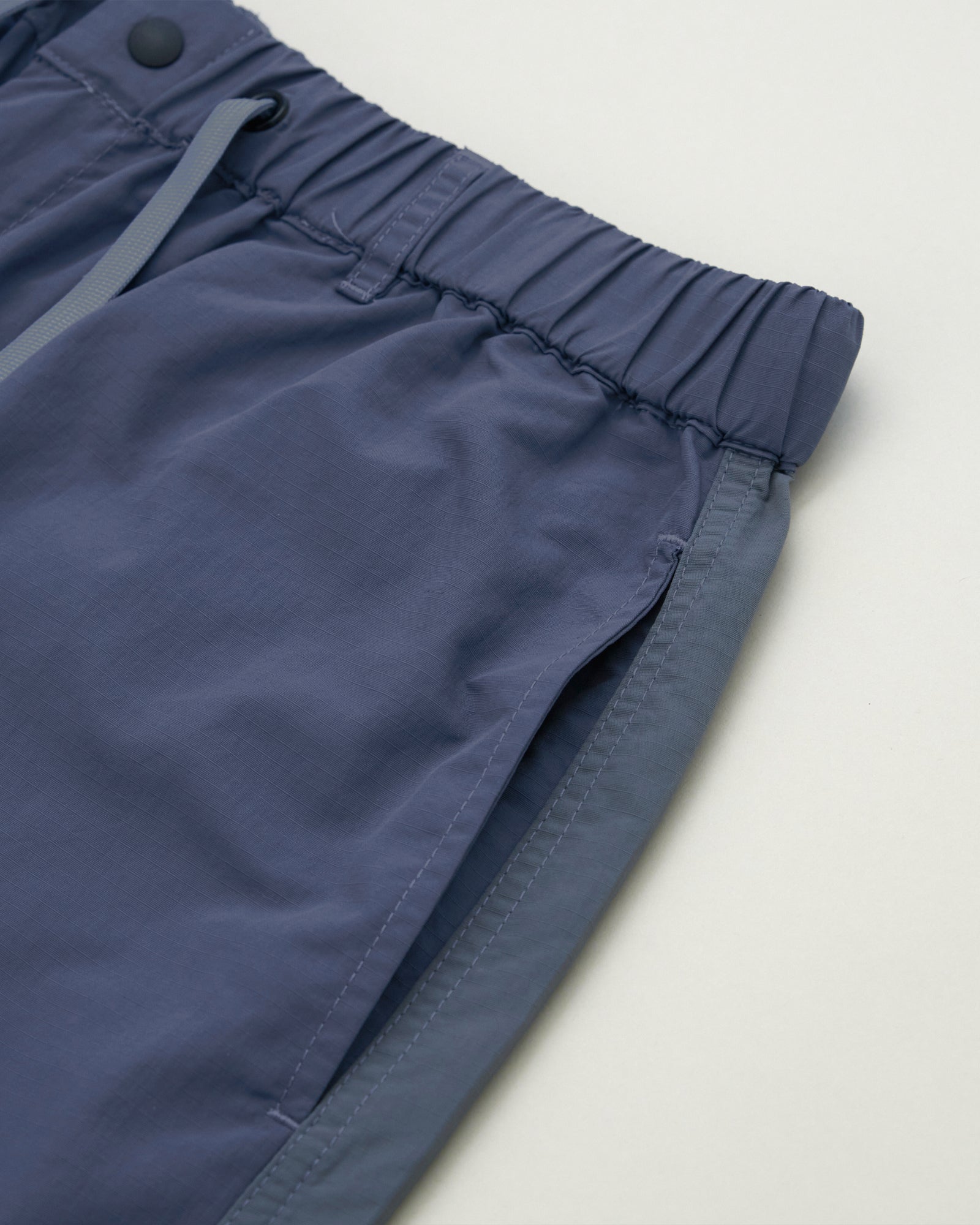 A Eckhaus Latta Shirt pictured on a model in front of a white background. The title of the product is Eckhaus Latta Eclipse Turtleneck - Stone and the image was taken by 199A®.