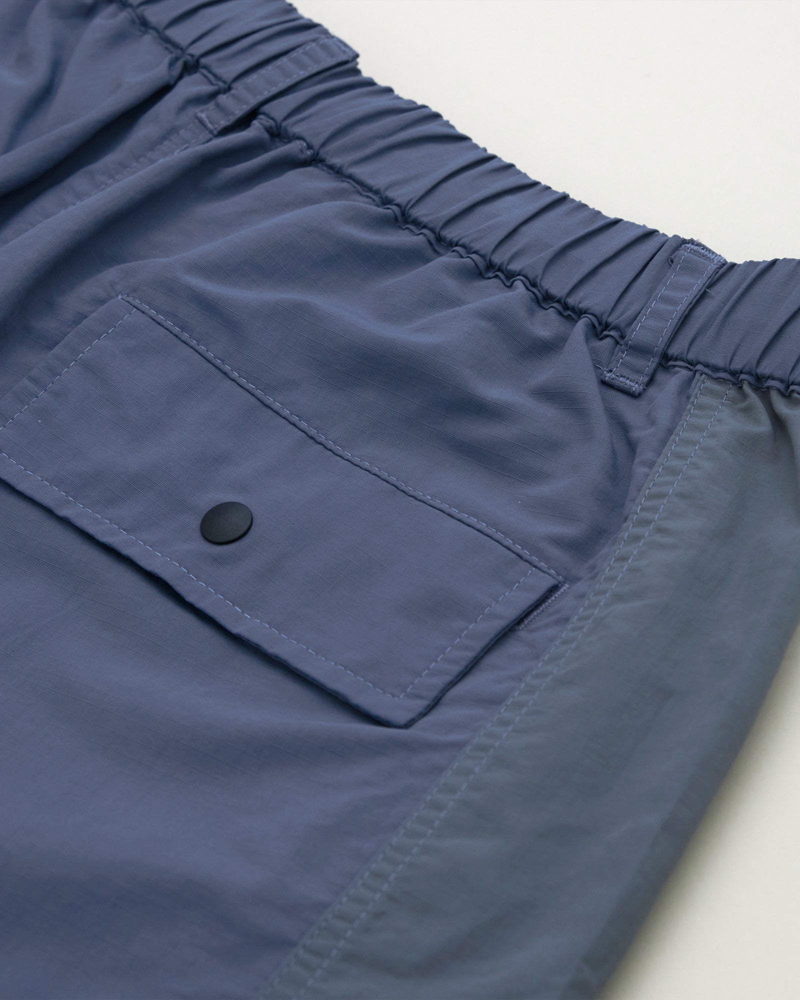 A Eckhaus Latta Shirt pictured on a model in front of a white background. The title of the product is Eckhaus Latta Eclipse Turtleneck - Stone and the image was taken by 199A®.