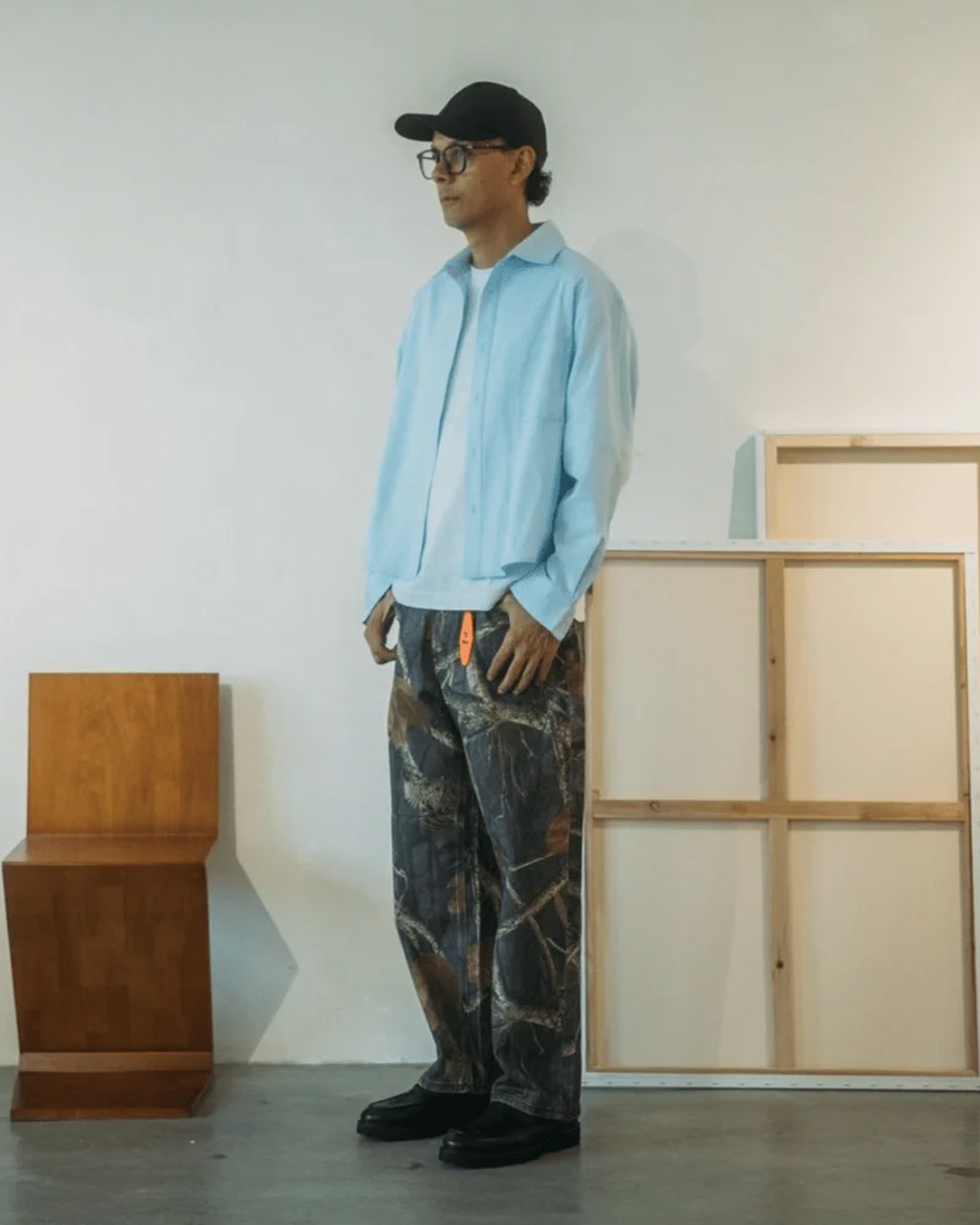 A Eckhaus Latta Shirt pictured on a model in front of a white background. The title of the product is Eckhaus Latta Eclipse Turtleneck - Stone and the image was taken by 199A®.