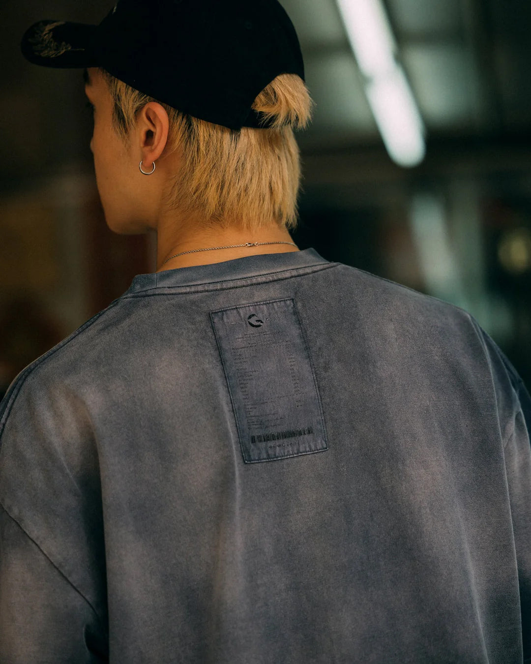 A Eckhaus Latta Shirt pictured on a model in front of a white background. The title of the product is Eckhaus Latta Eclipse Turtleneck - Stone and the image was taken by 199A®.