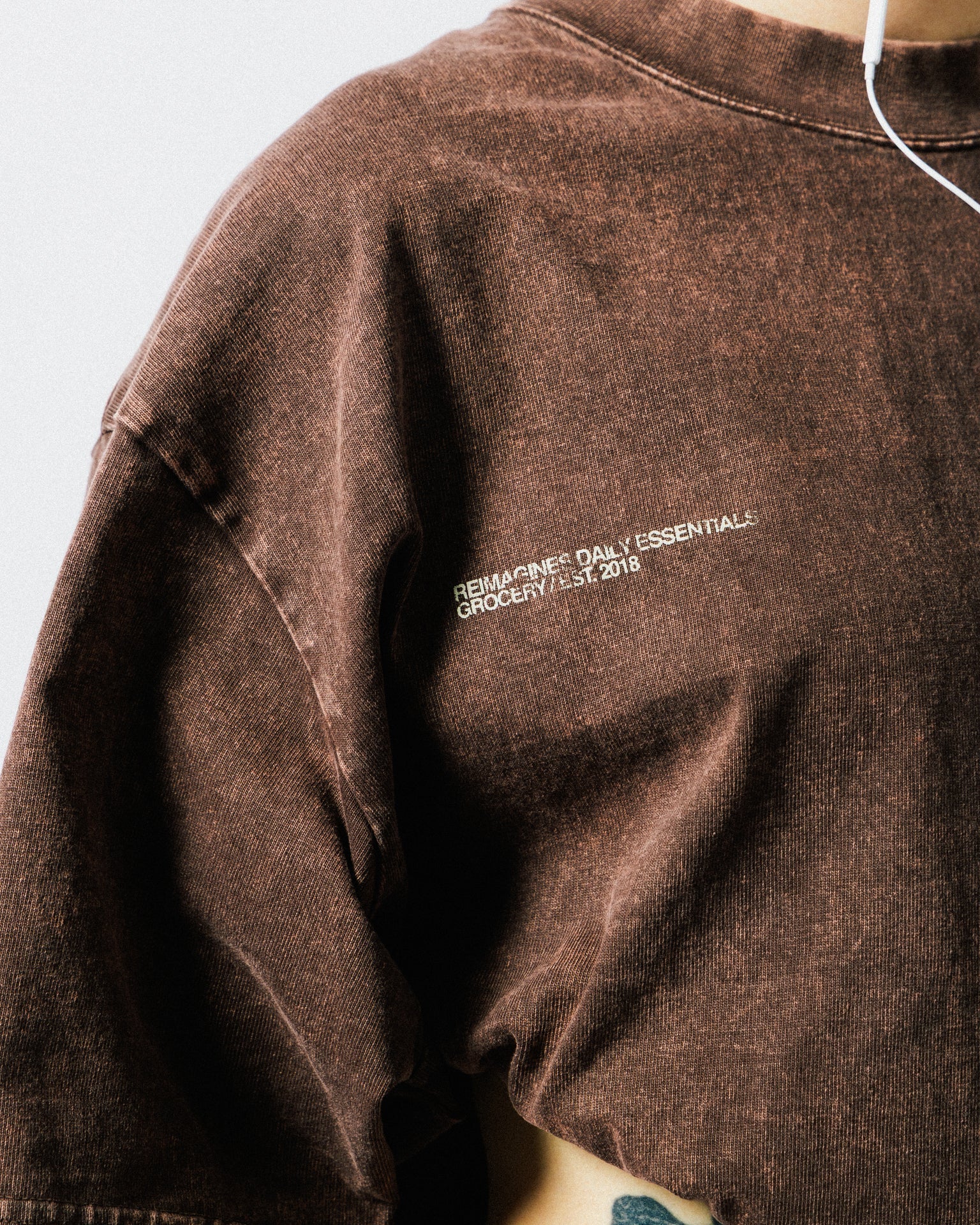 A Eckhaus Latta Shirt pictured on a model in front of a white background. The title of the product is Eckhaus Latta Eclipse Turtleneck - Stone and the image was taken by 199A®.