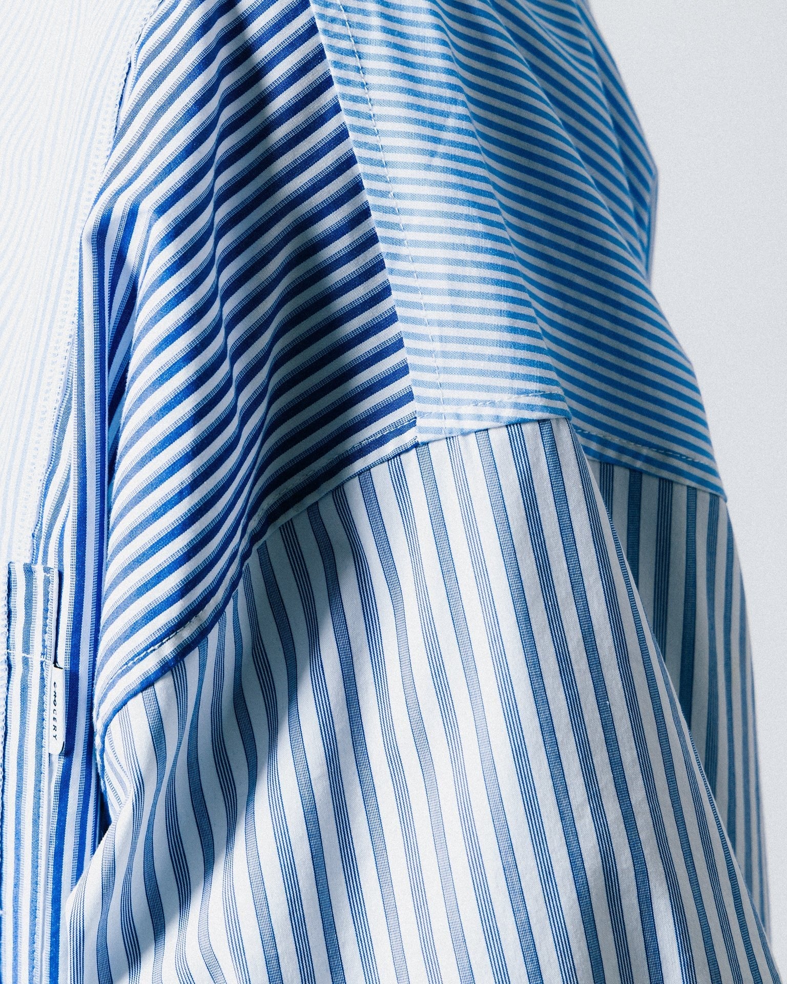 A Eckhaus Latta Shirt pictured on a model in front of a white background. The title of the product is Eckhaus Latta Eclipse Turtleneck - Stone and the image was taken by 199A®.