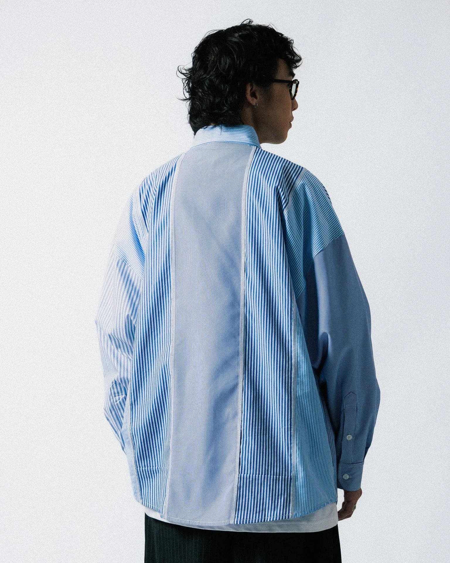 A Eckhaus Latta Shirt pictured on a model in front of a white background. The title of the product is Eckhaus Latta Eclipse Turtleneck - Stone and the image was taken by 199A®.