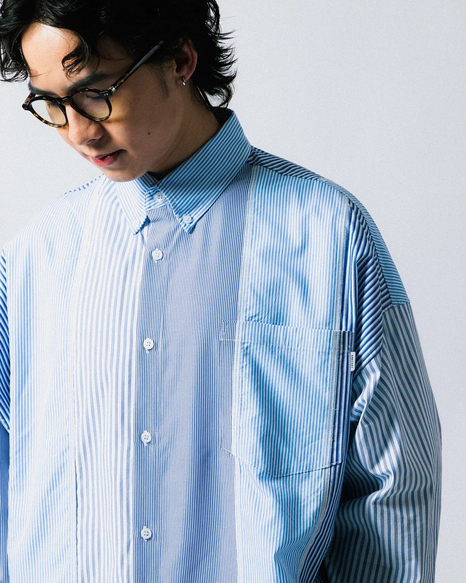 A Eckhaus Latta Shirt pictured on a model in front of a white background. The title of the product is Eckhaus Latta Eclipse Turtleneck - Stone and the image was taken by 199A®.