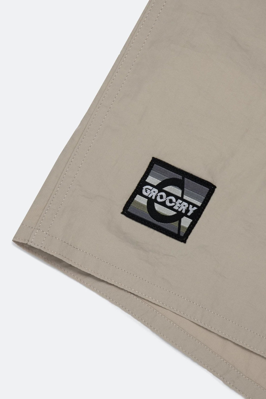 A Eckhaus Latta Shirt pictured on a model in front of a white background. The title of the product is Eckhaus Latta Eclipse Turtleneck - Stone and the image was taken by 199A®.