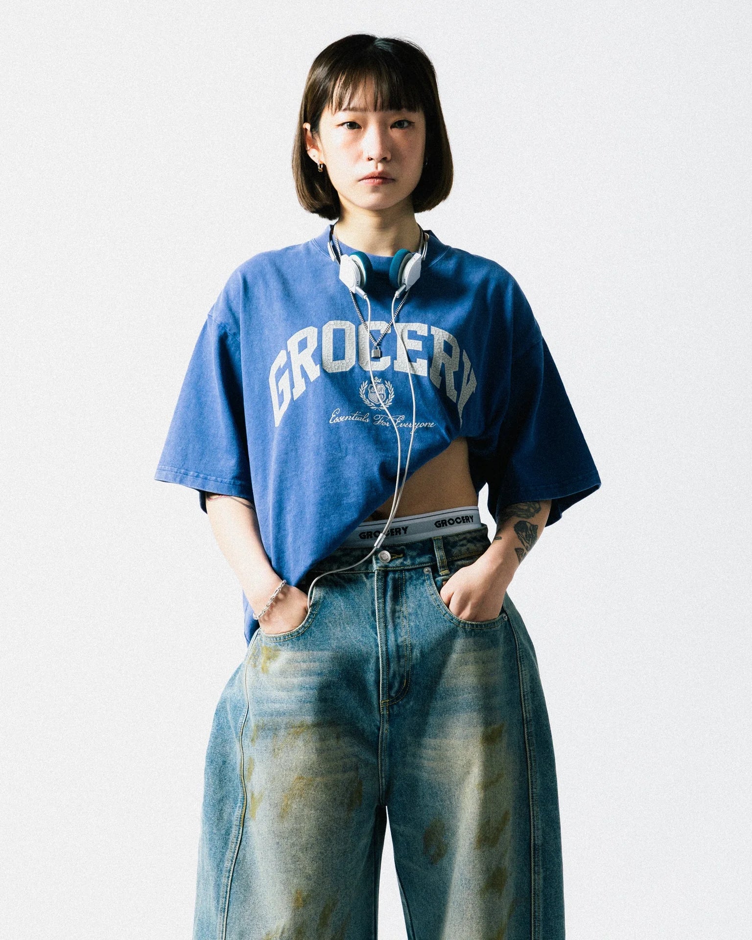 A Eckhaus Latta Shirt pictured on a model in front of a white background. The title of the product is Eckhaus Latta Eclipse Turtleneck - Stone and the image was taken by 199A®.