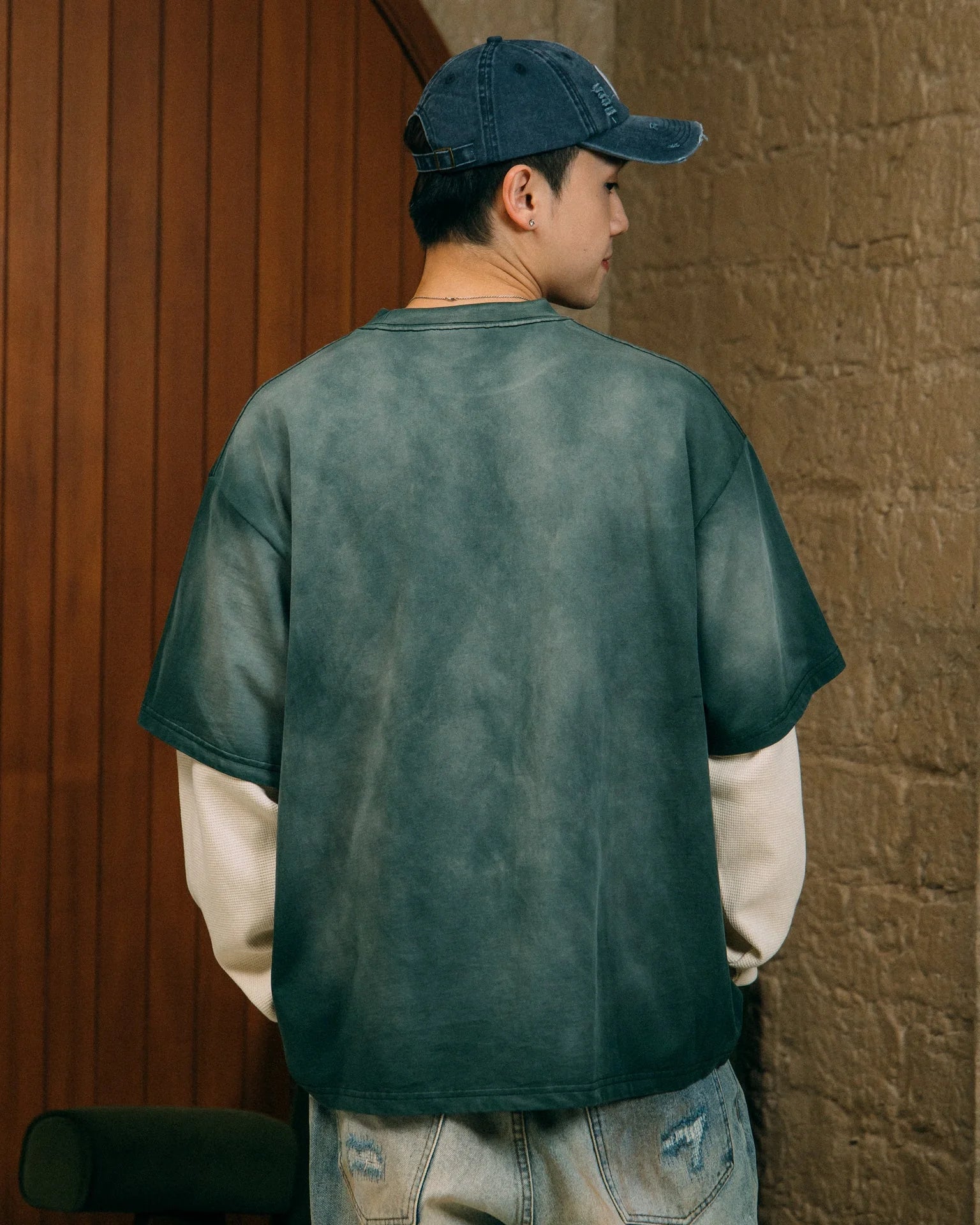 A Eckhaus Latta Shirt pictured on a model in front of a white background. The title of the product is Eckhaus Latta Eclipse Turtleneck - Stone and the image was taken by 199A®.