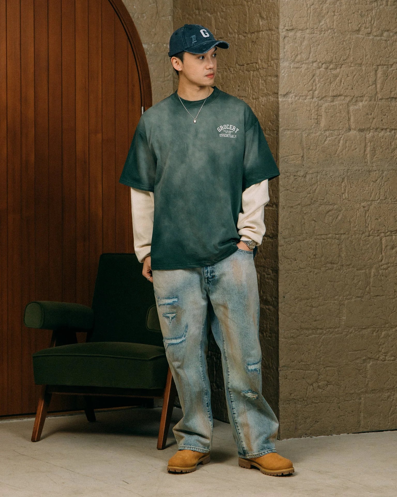 A Eckhaus Latta Shirt pictured on a model in front of a white background. The title of the product is Eckhaus Latta Eclipse Turtleneck - Stone and the image was taken by 199A®.