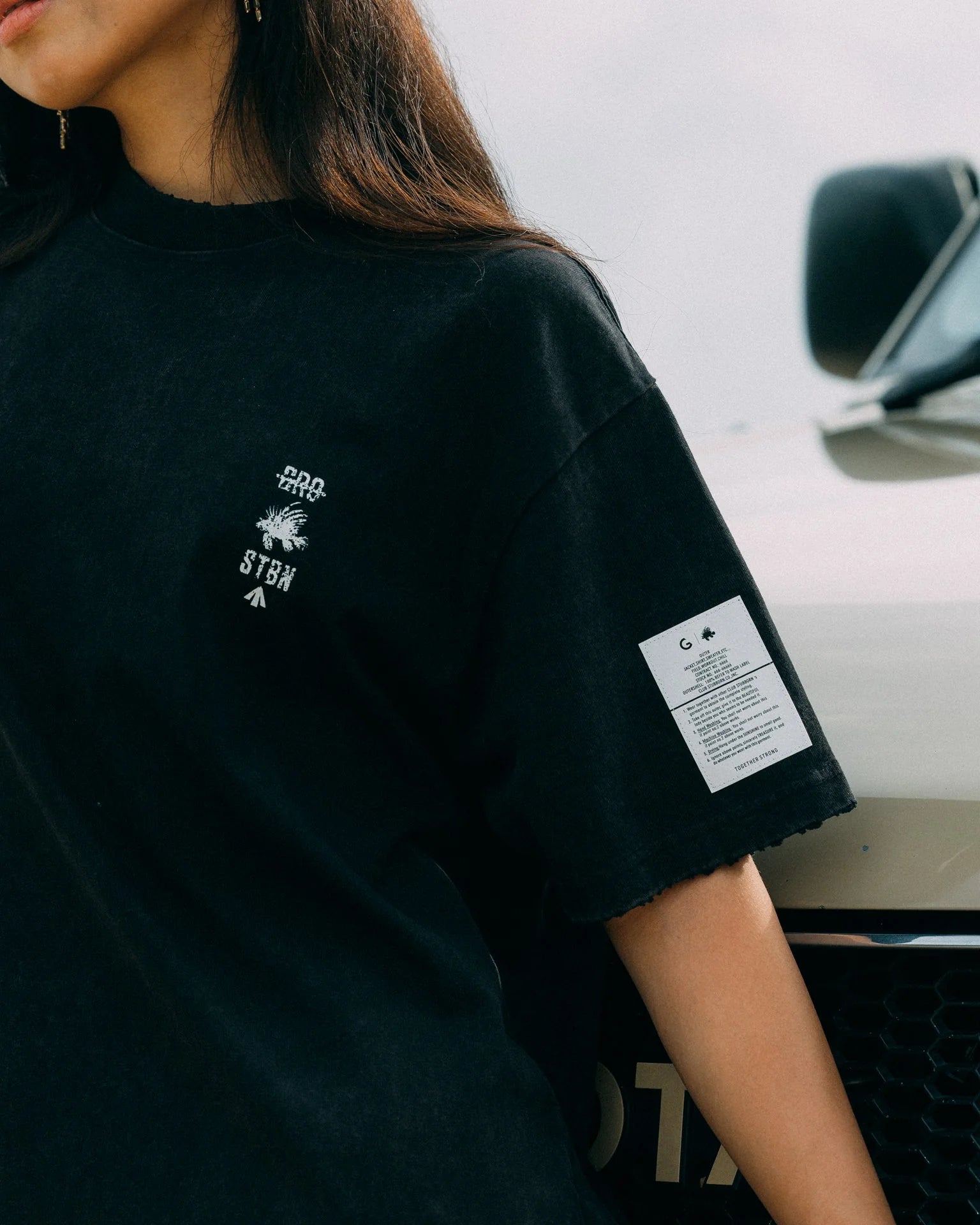 A Eckhaus Latta Shirt pictured on a model in front of a white background. The title of the product is Eckhaus Latta Eclipse Turtleneck - Stone and the image was taken by 199A®.