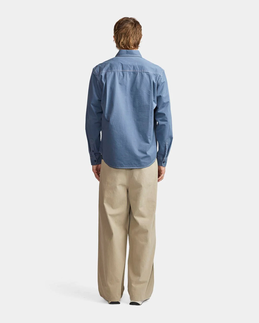 A Eckhaus Latta Shirt pictured on a model in front of a white background. The title of the product is Eckhaus Latta Eclipse Turtleneck - Stone and the image was taken by 199A®.