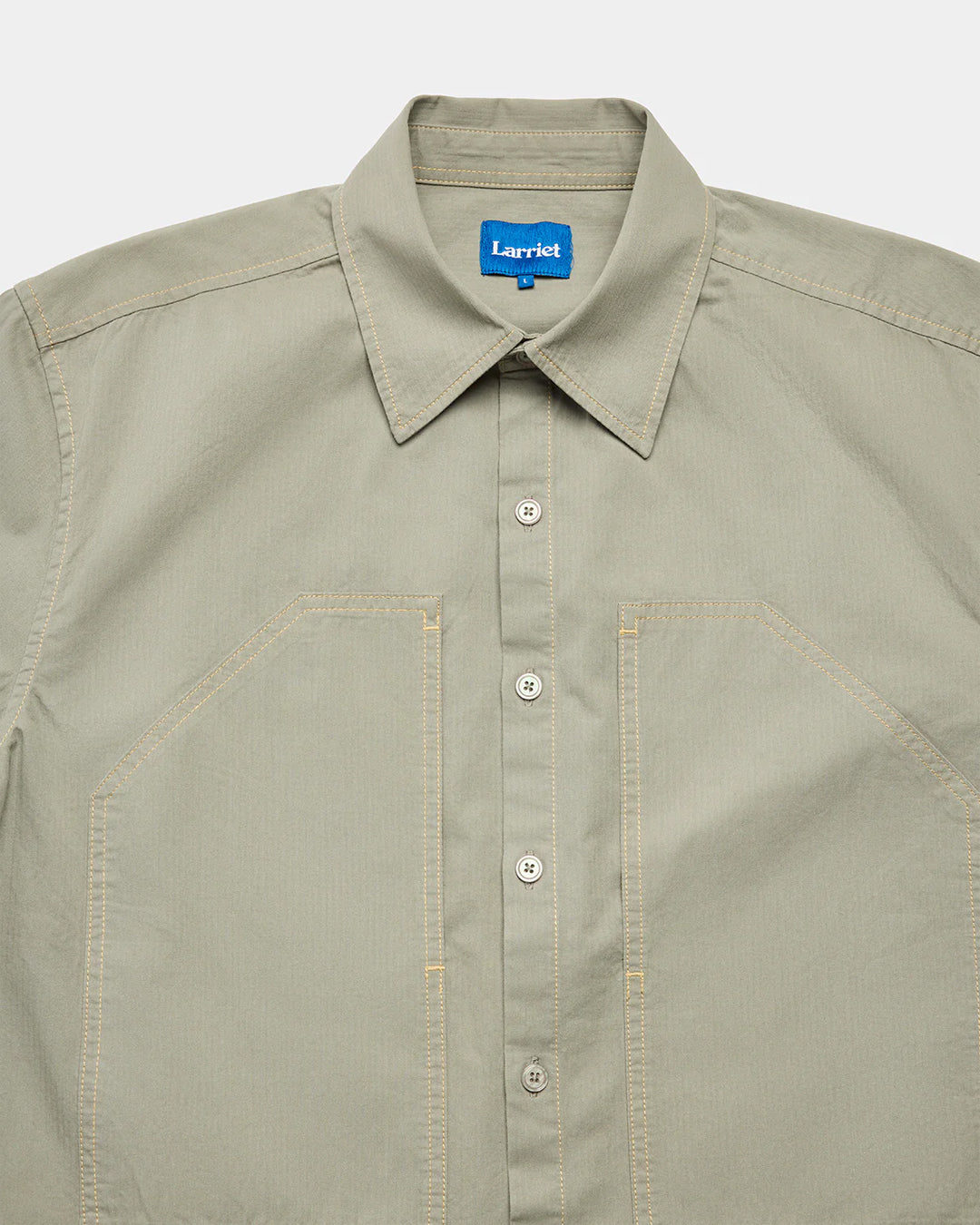 A Eckhaus Latta Shirt pictured on a model in front of a white background. The title of the product is Eckhaus Latta Eclipse Turtleneck - Stone and the image was taken by 199A®.