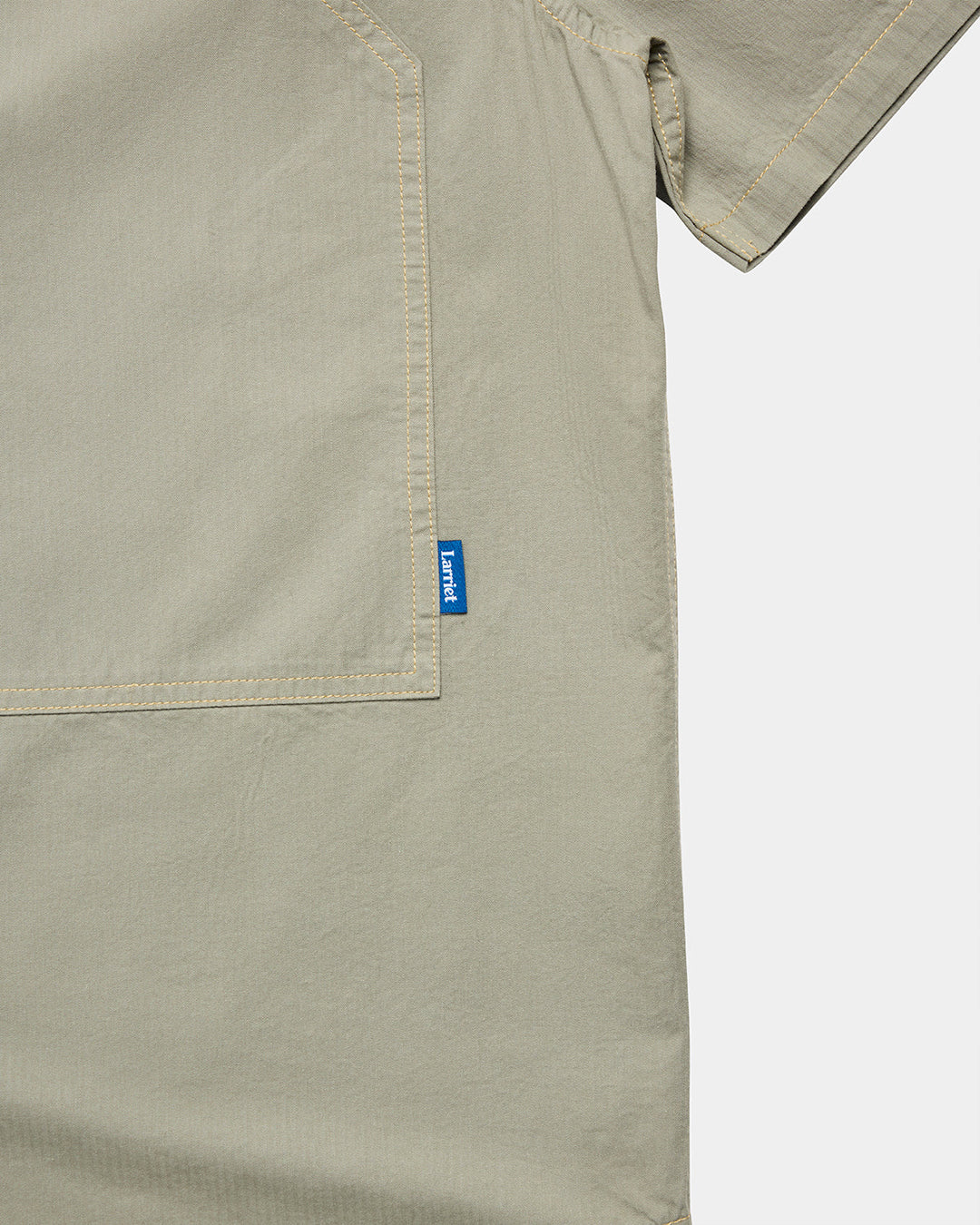 A Eckhaus Latta Shirt pictured on a model in front of a white background. The title of the product is Eckhaus Latta Eclipse Turtleneck - Stone and the image was taken by 199A®.