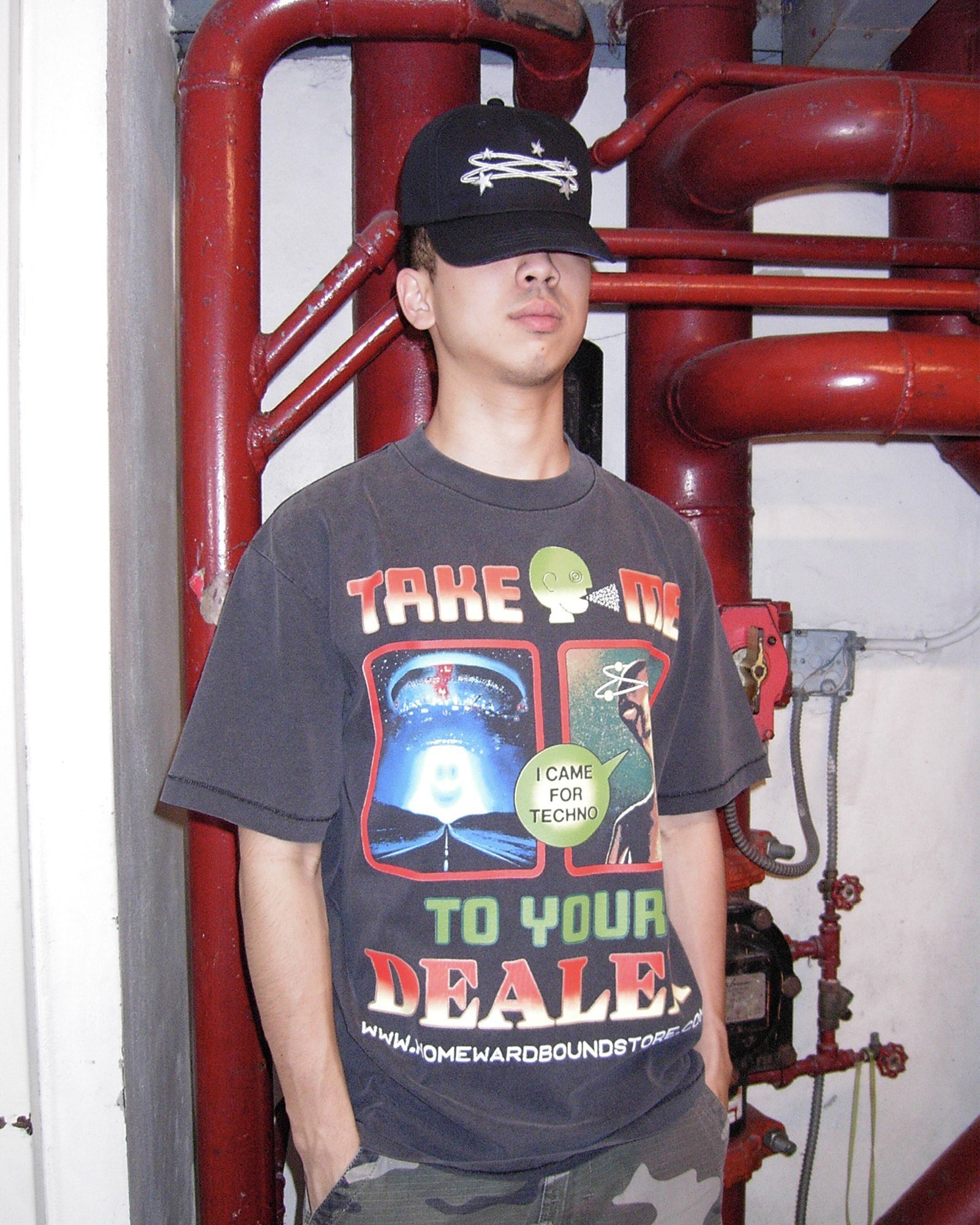 A Eckhaus Latta Shirt pictured on a model in front of a white background. The title of the product is Eckhaus Latta Eclipse Turtleneck - Stone and the image was taken by 199A®.