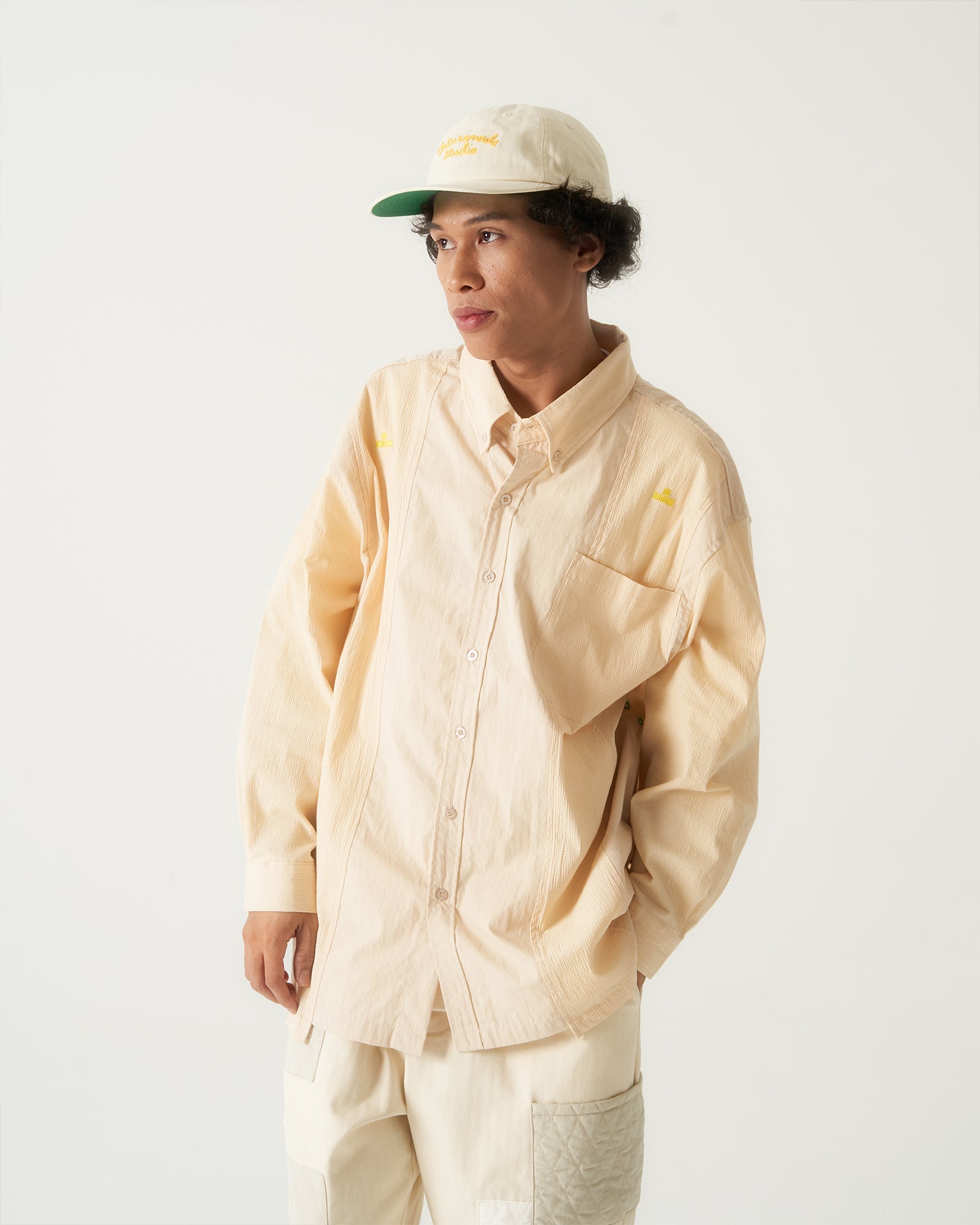 A Eckhaus Latta Shirt pictured on a model in front of a white background. The title of the product is Eckhaus Latta Eclipse Turtleneck - Stone and the image was taken by 199A®.