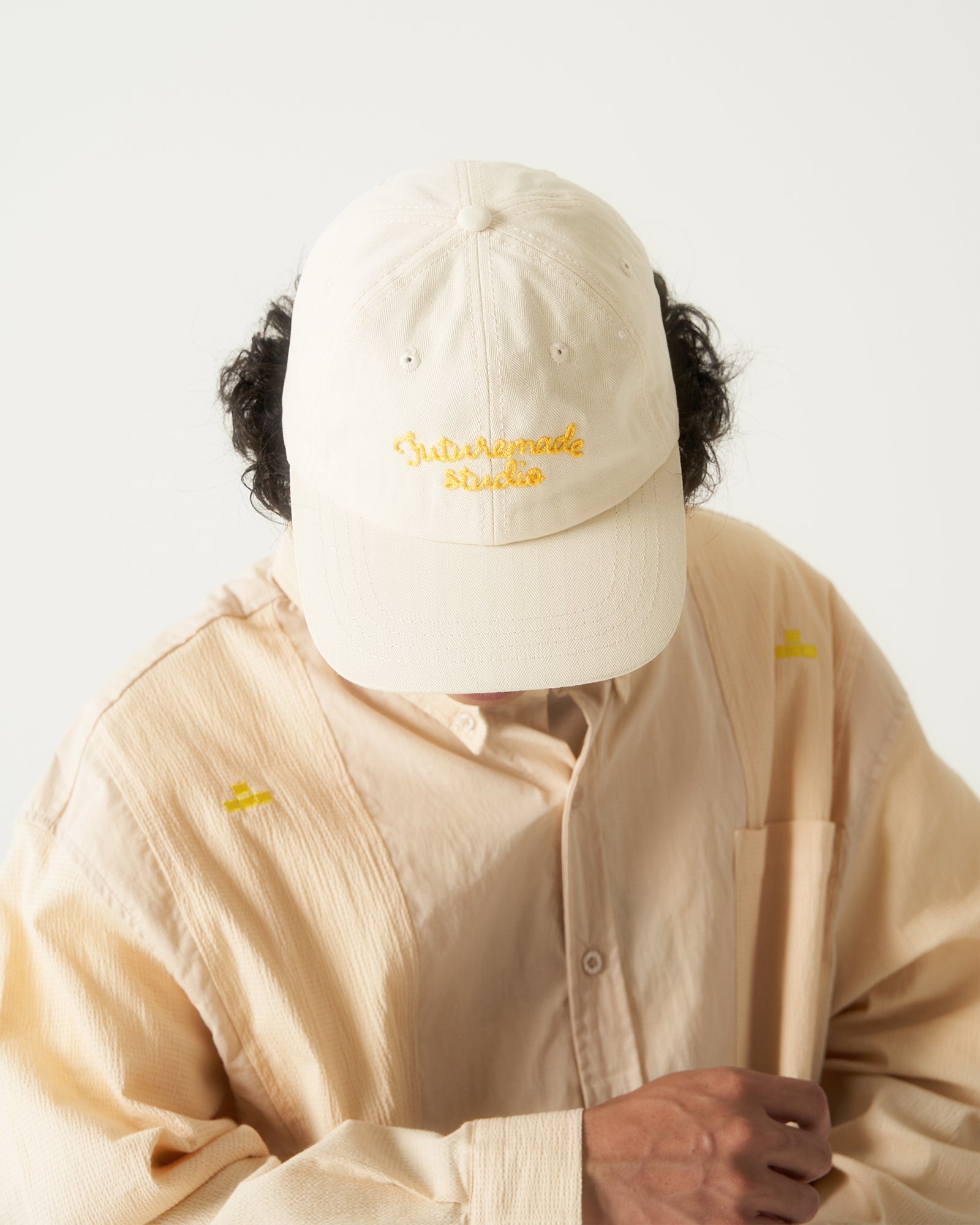 A Eckhaus Latta Shirt pictured on a model in front of a white background. The title of the product is Eckhaus Latta Eclipse Turtleneck - Stone and the image was taken by 199A®.