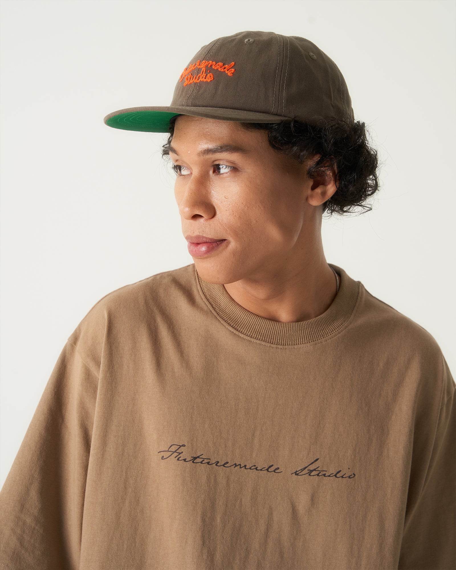 A Eckhaus Latta Shirt pictured on a model in front of a white background. The title of the product is Eckhaus Latta Eclipse Turtleneck - Stone and the image was taken by 199A®.