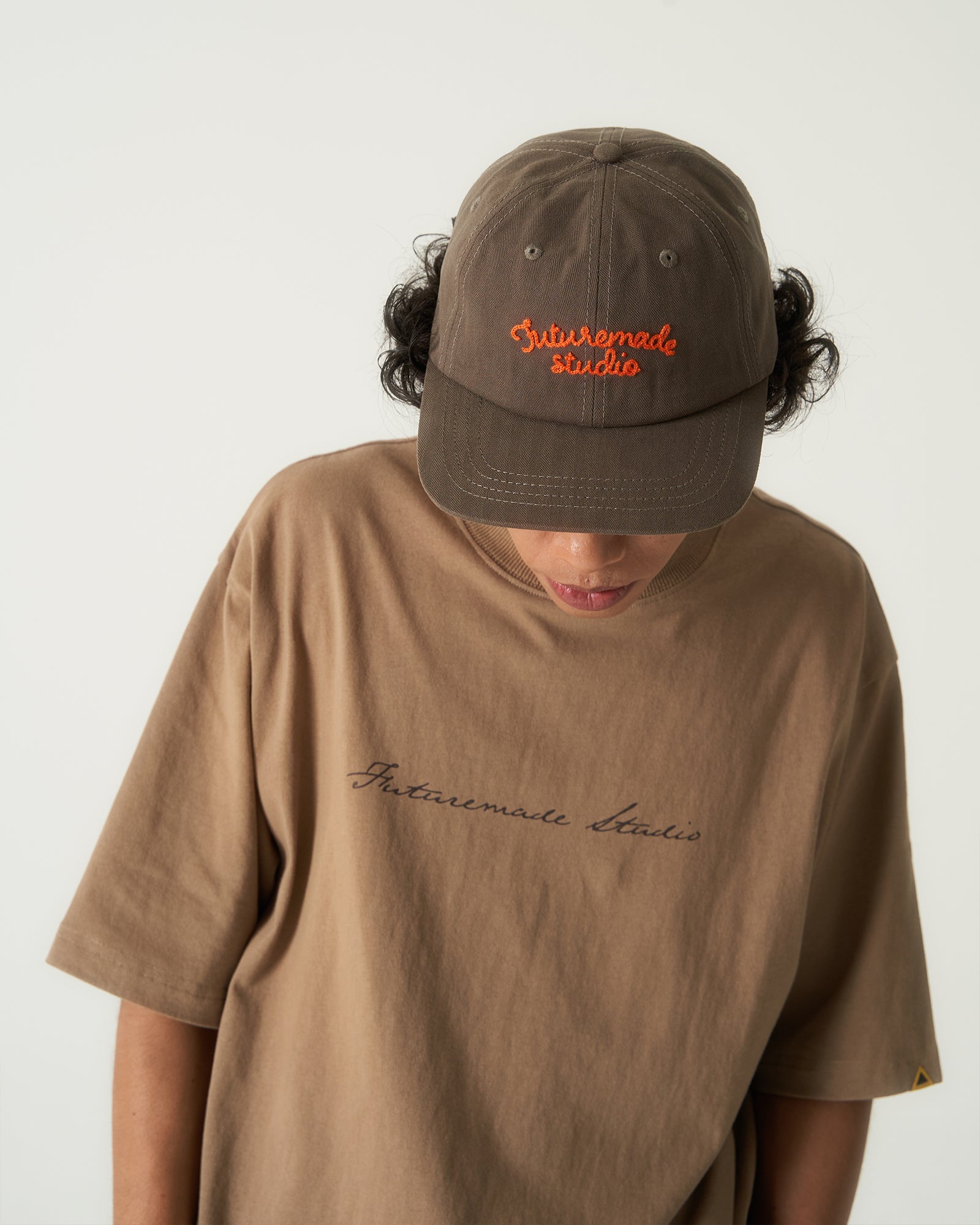 A Eckhaus Latta Shirt pictured on a model in front of a white background. The title of the product is Eckhaus Latta Eclipse Turtleneck - Stone and the image was taken by 199A®.