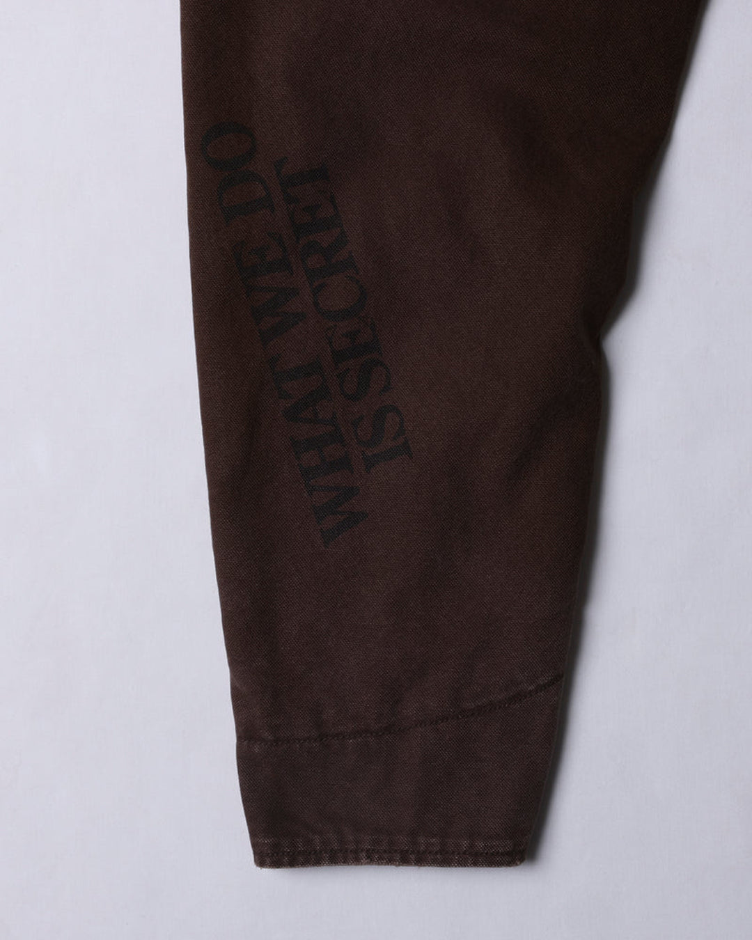 A Eckhaus Latta Shirt pictured on a model in front of a white background. The title of the product is Eckhaus Latta Eclipse Turtleneck - Stone and the image was taken by 199A®.