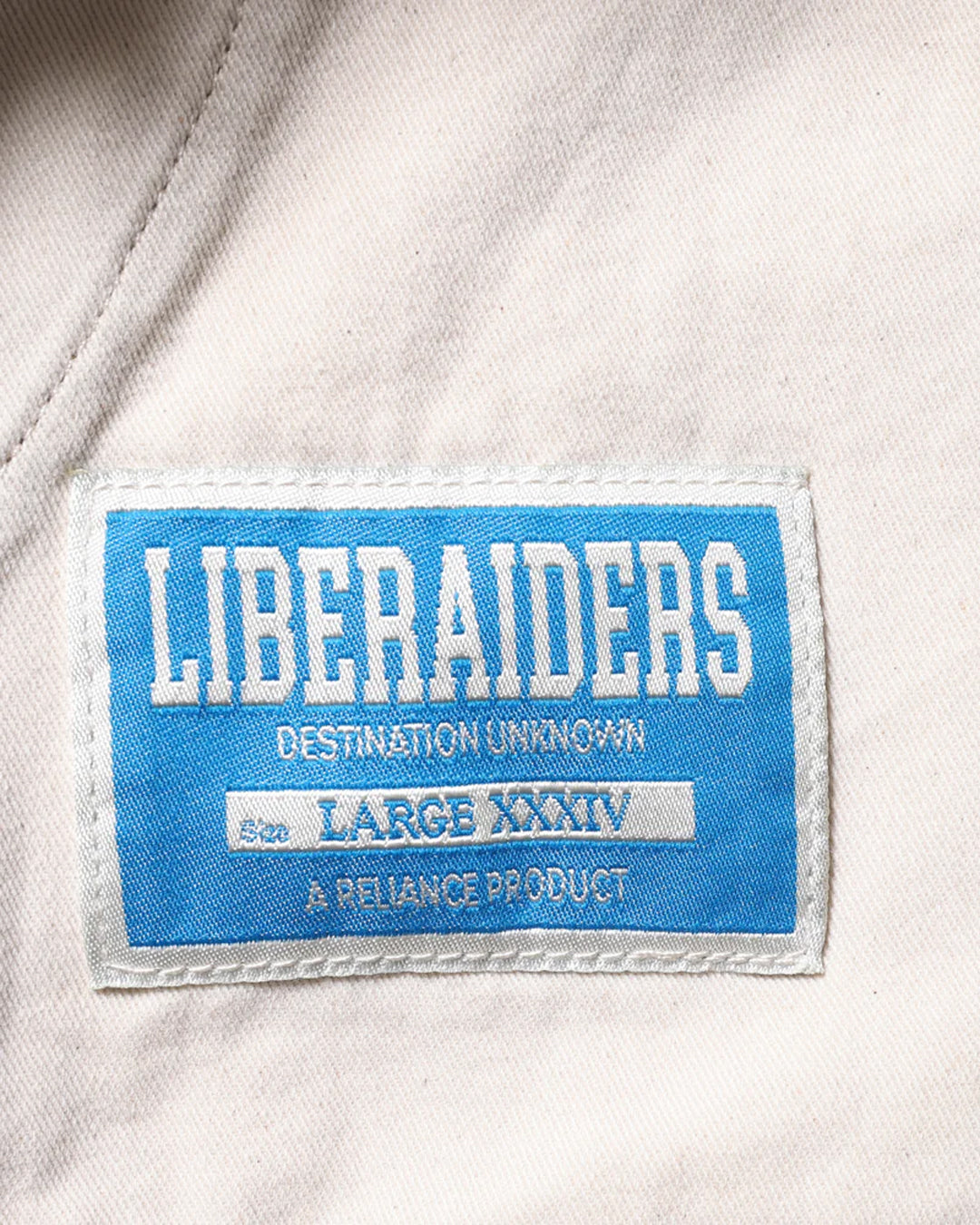 A Eckhaus Latta Shirt pictured on a model in front of a white background. The title of the product is Eckhaus Latta Eclipse Turtleneck - Stone and the image was taken by 199A®.