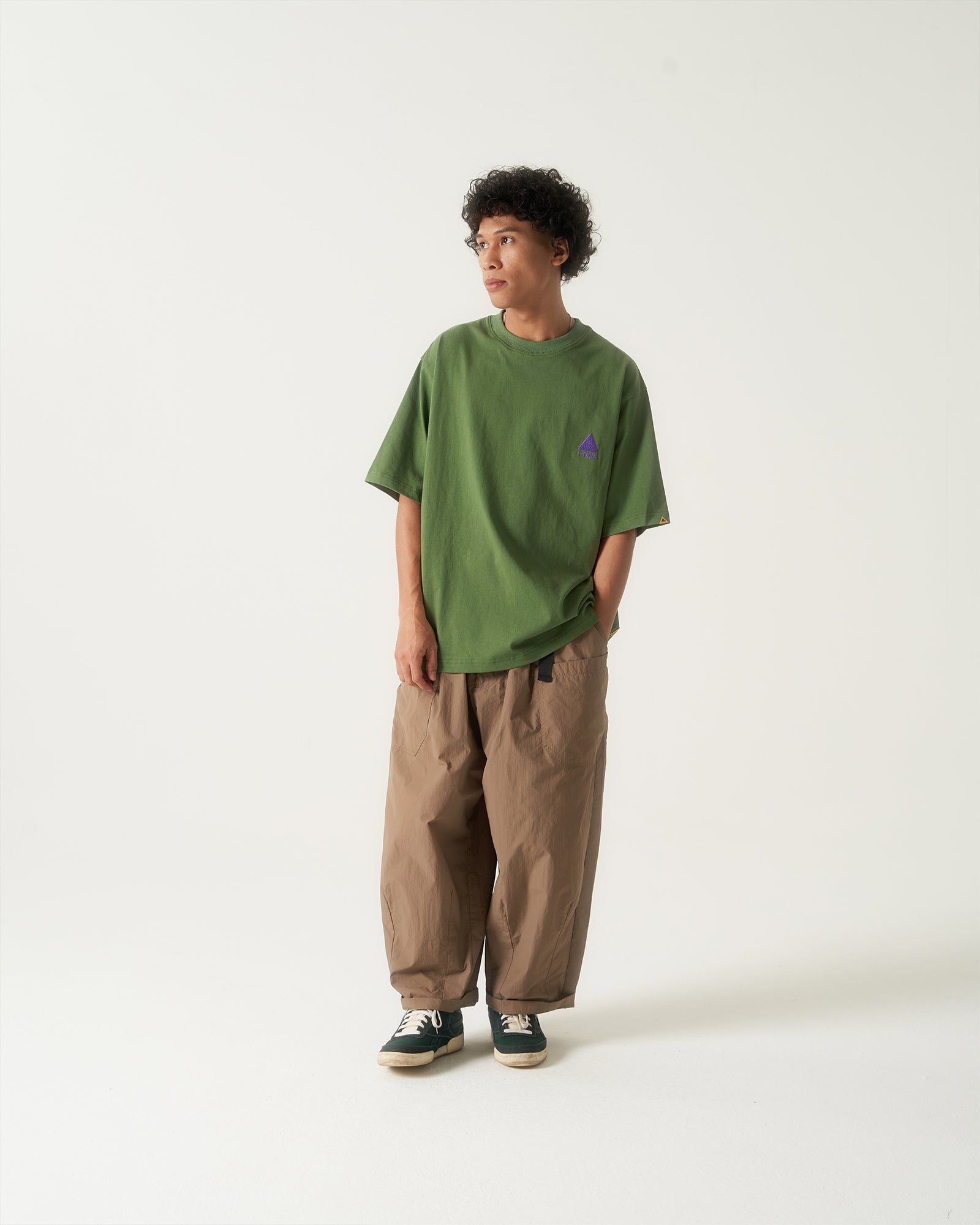 A Eckhaus Latta Shirt pictured on a model in front of a white background. The title of the product is Eckhaus Latta Eclipse Turtleneck - Stone and the image was taken by 199A®.