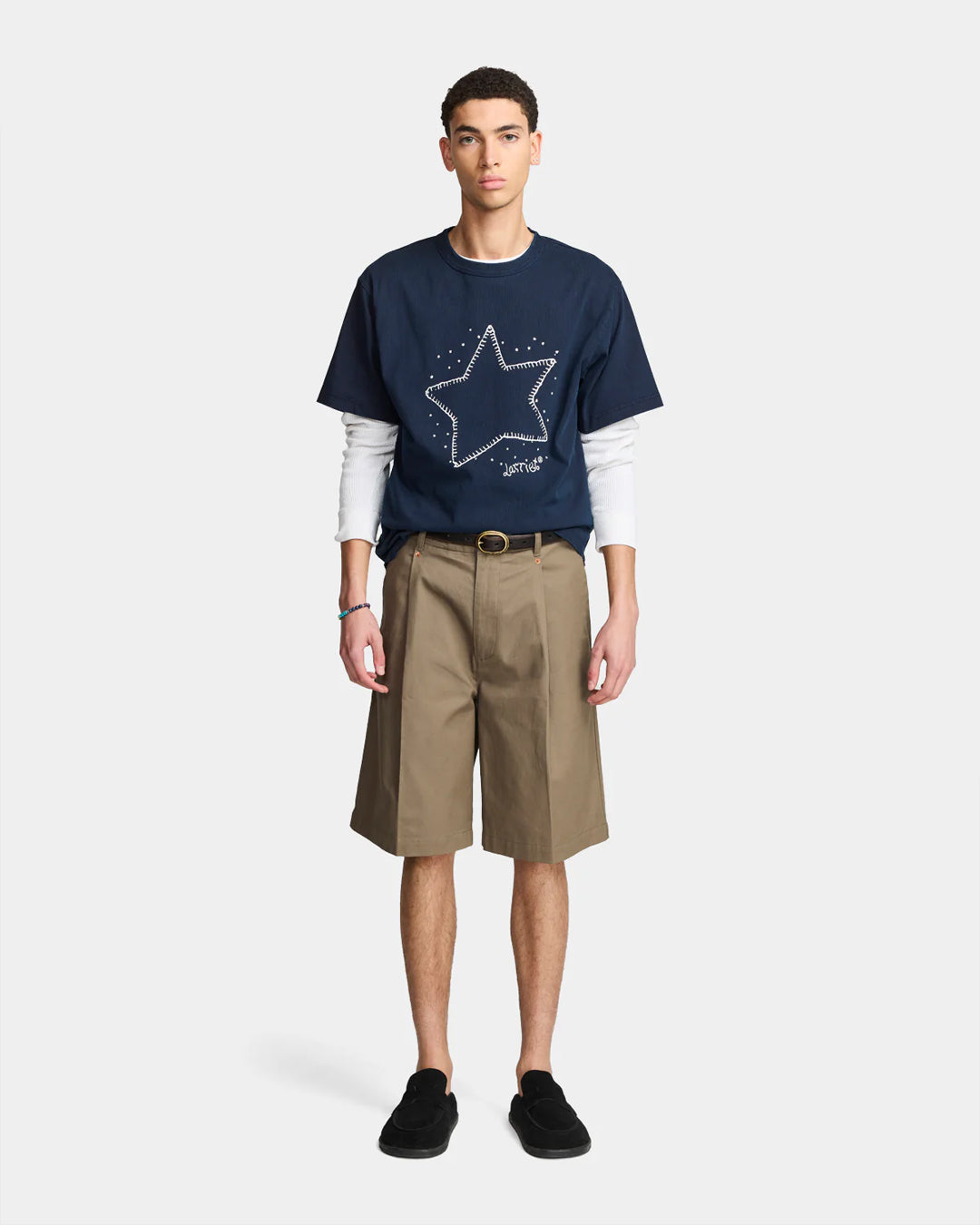 A Eckhaus Latta Shirt pictured on a model in front of a white background. The title of the product is Eckhaus Latta Eclipse Turtleneck - Stone and the image was taken by 199A®.
