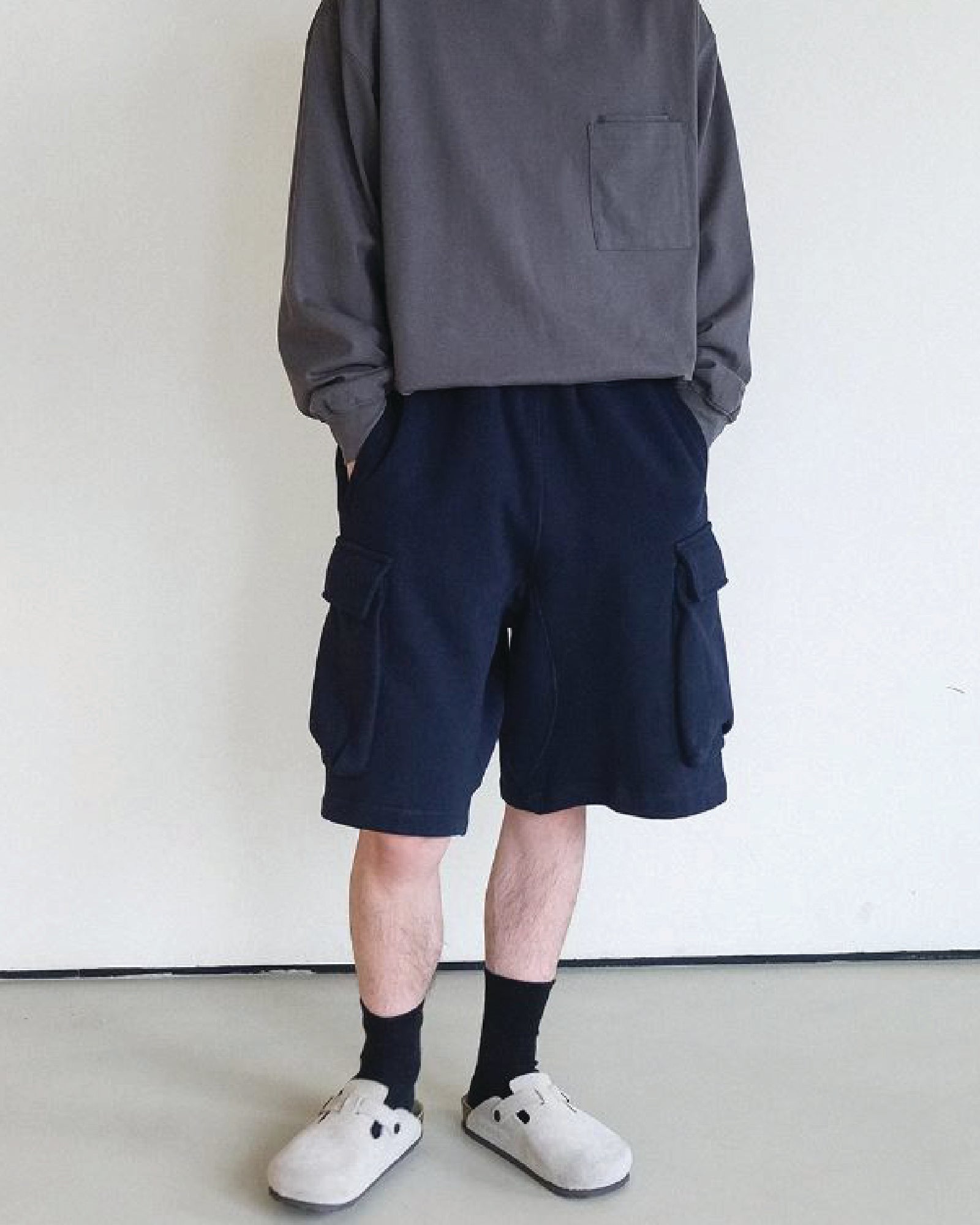 A Eckhaus Latta Shirt pictured on a model in front of a white background. The title of the product is Eckhaus Latta Eclipse Turtleneck - Stone and the image was taken by 199A®.