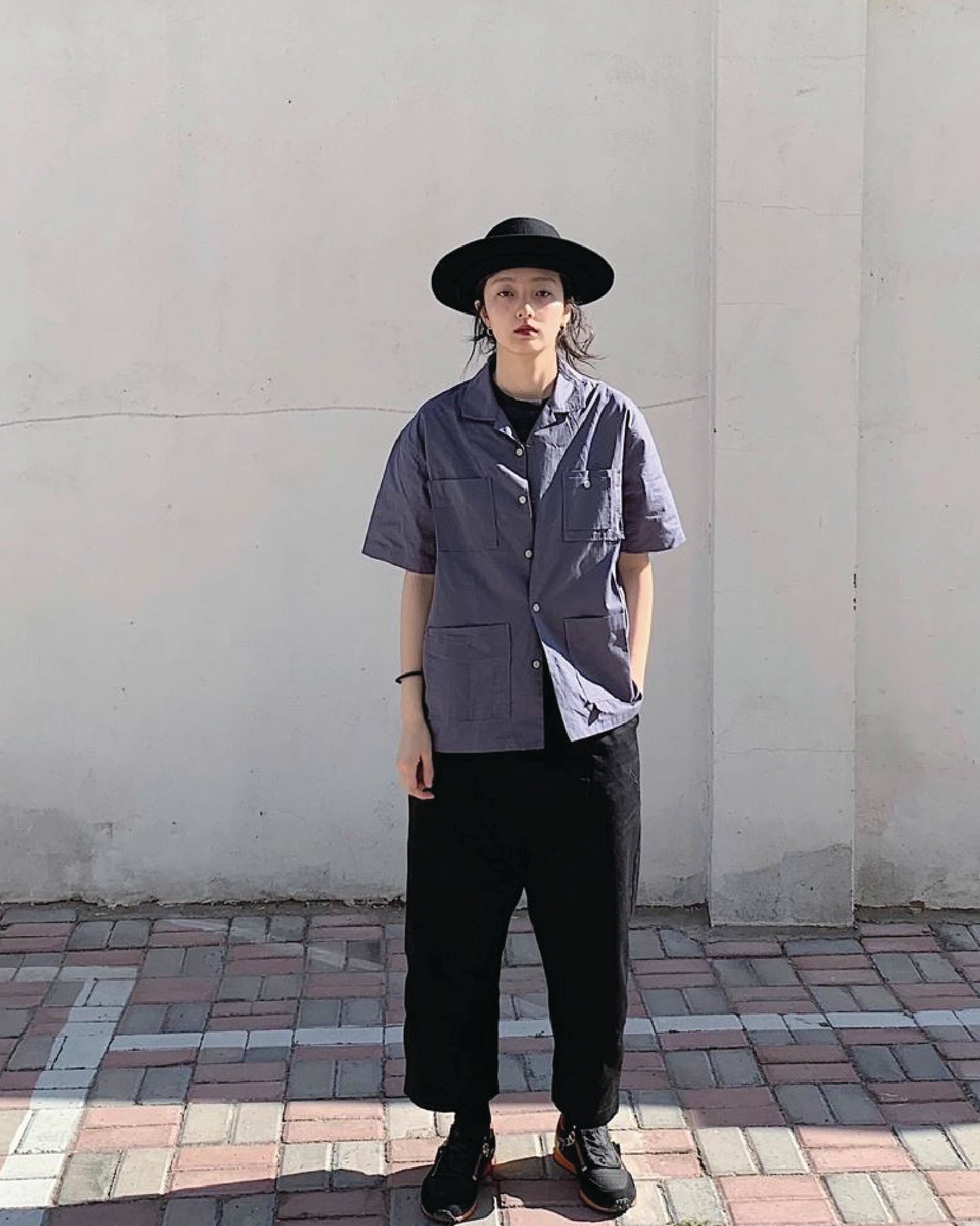 A Eckhaus Latta Shirt pictured on a model in front of a white background. The title of the product is Eckhaus Latta Eclipse Turtleneck - Stone and the image was taken by 199A®.