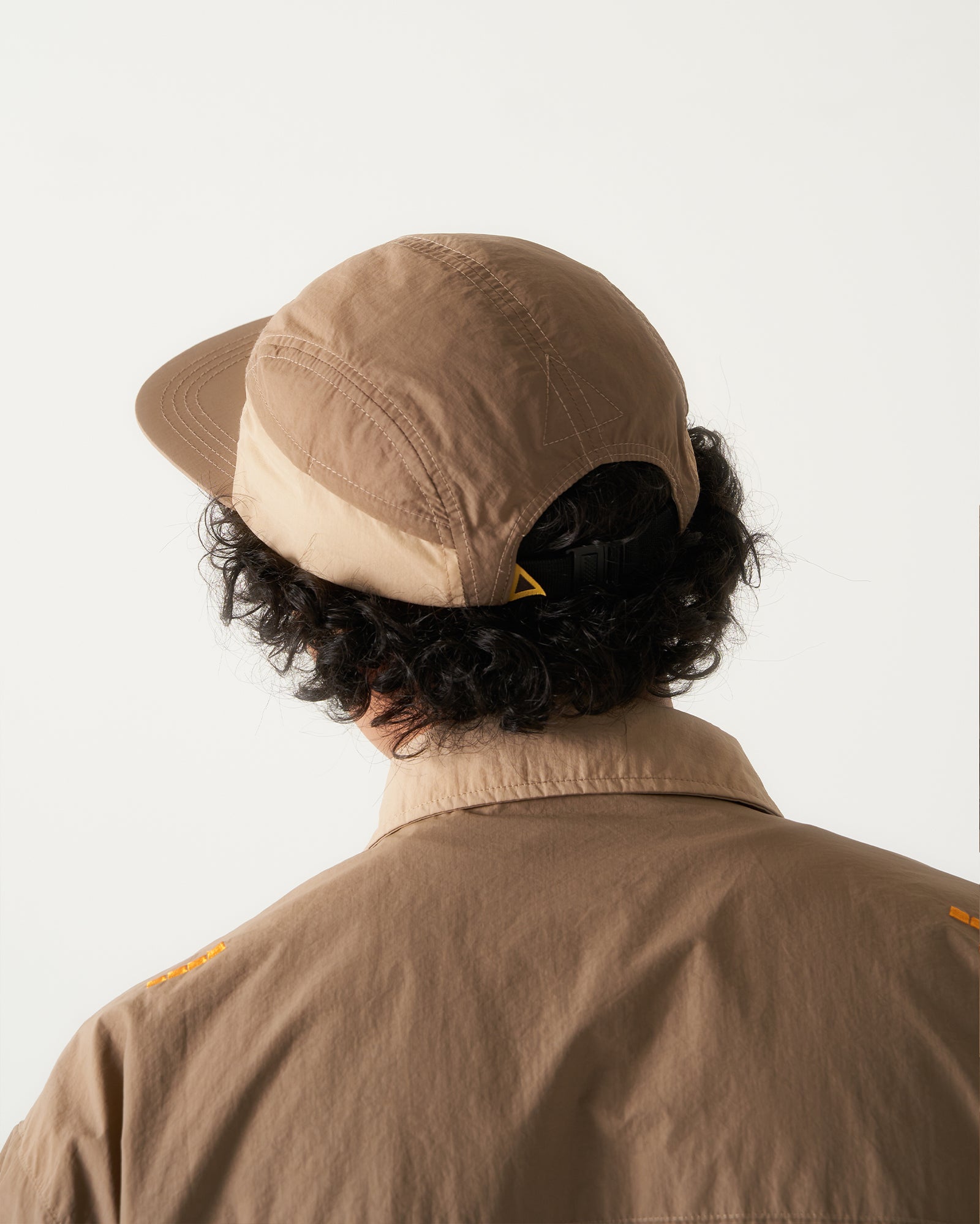 A Eckhaus Latta Shirt pictured on a model in front of a white background. The title of the product is Eckhaus Latta Eclipse Turtleneck - Stone and the image was taken by 199A®.