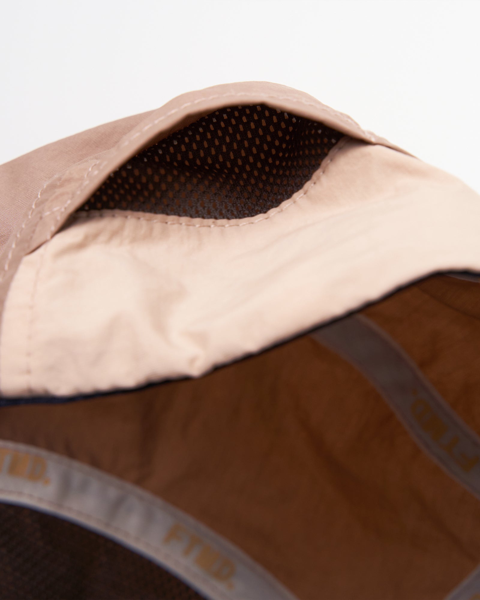 A Eckhaus Latta Shirt pictured on a model in front of a white background. The title of the product is Eckhaus Latta Eclipse Turtleneck - Stone and the image was taken by 199A®.