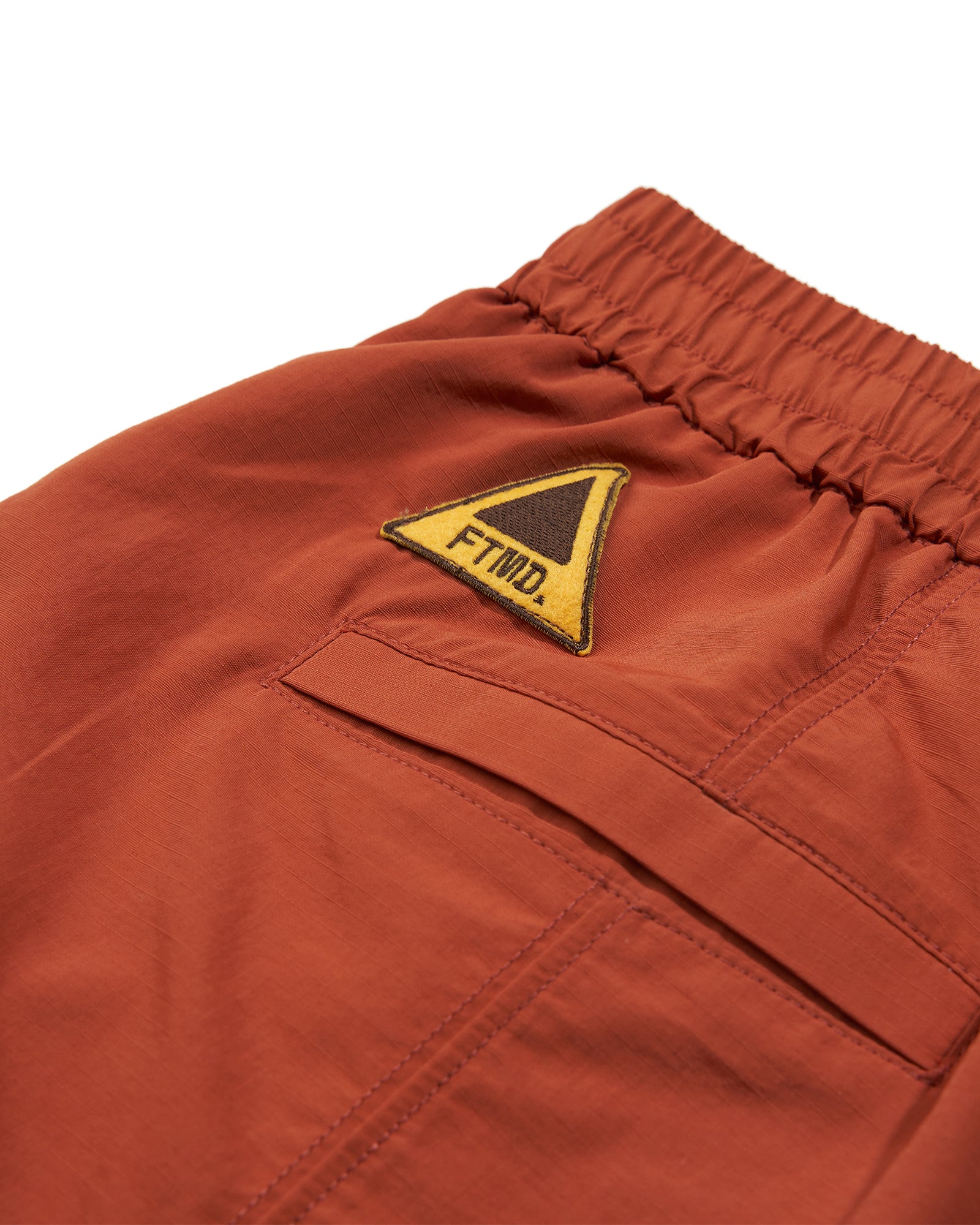 A Eckhaus Latta Shirt pictured on a model in front of a white background. The title of the product is Eckhaus Latta Eclipse Turtleneck - Stone and the image was taken by 199A®.