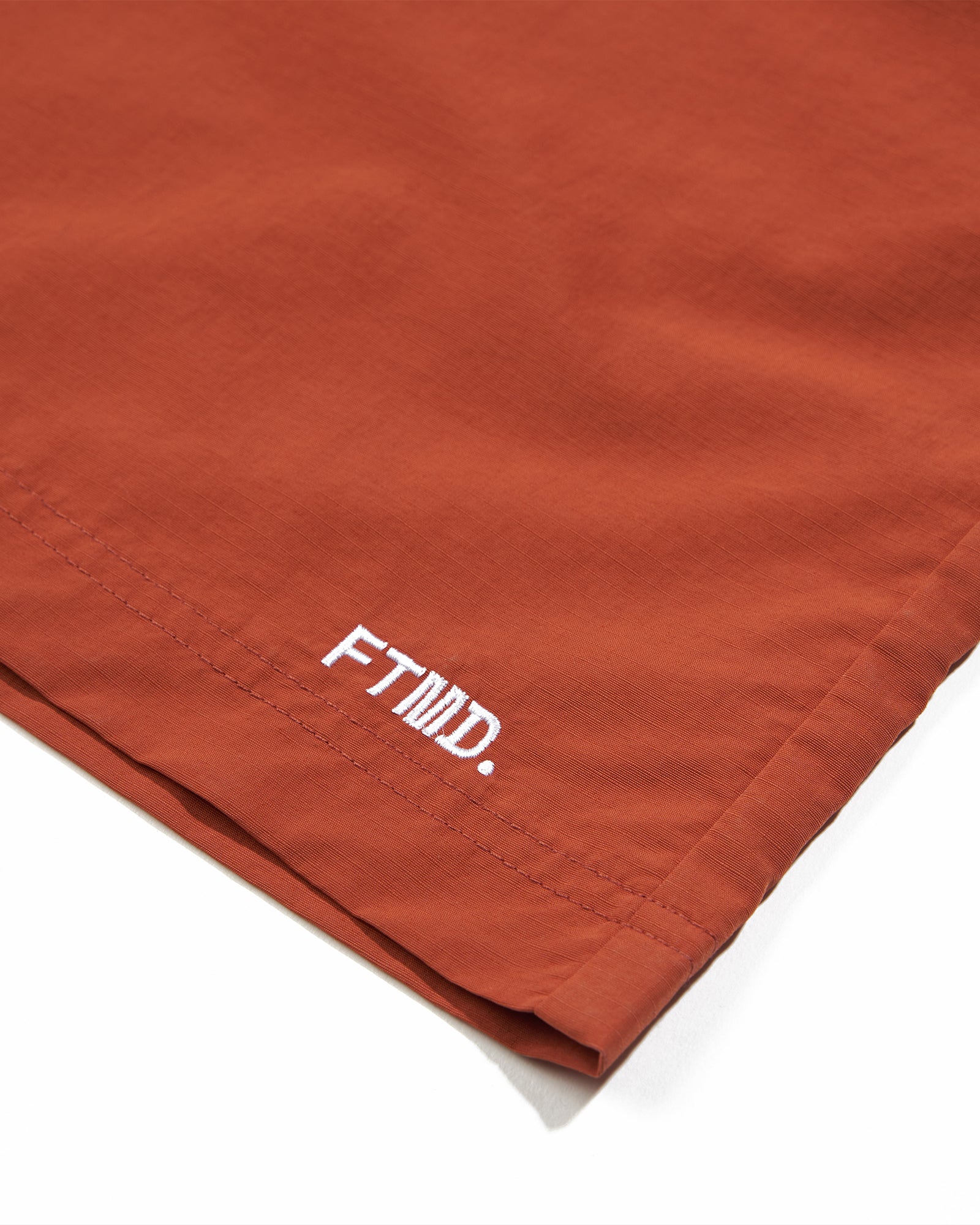 A Eckhaus Latta Shirt pictured on a model in front of a white background. The title of the product is Eckhaus Latta Eclipse Turtleneck - Stone and the image was taken by 199A®.