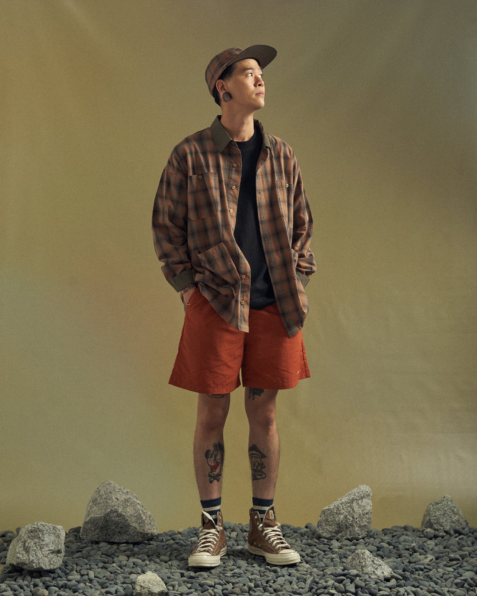 A Eckhaus Latta Shirt pictured on a model in front of a white background. The title of the product is Eckhaus Latta Eclipse Turtleneck - Stone and the image was taken by 199A®.