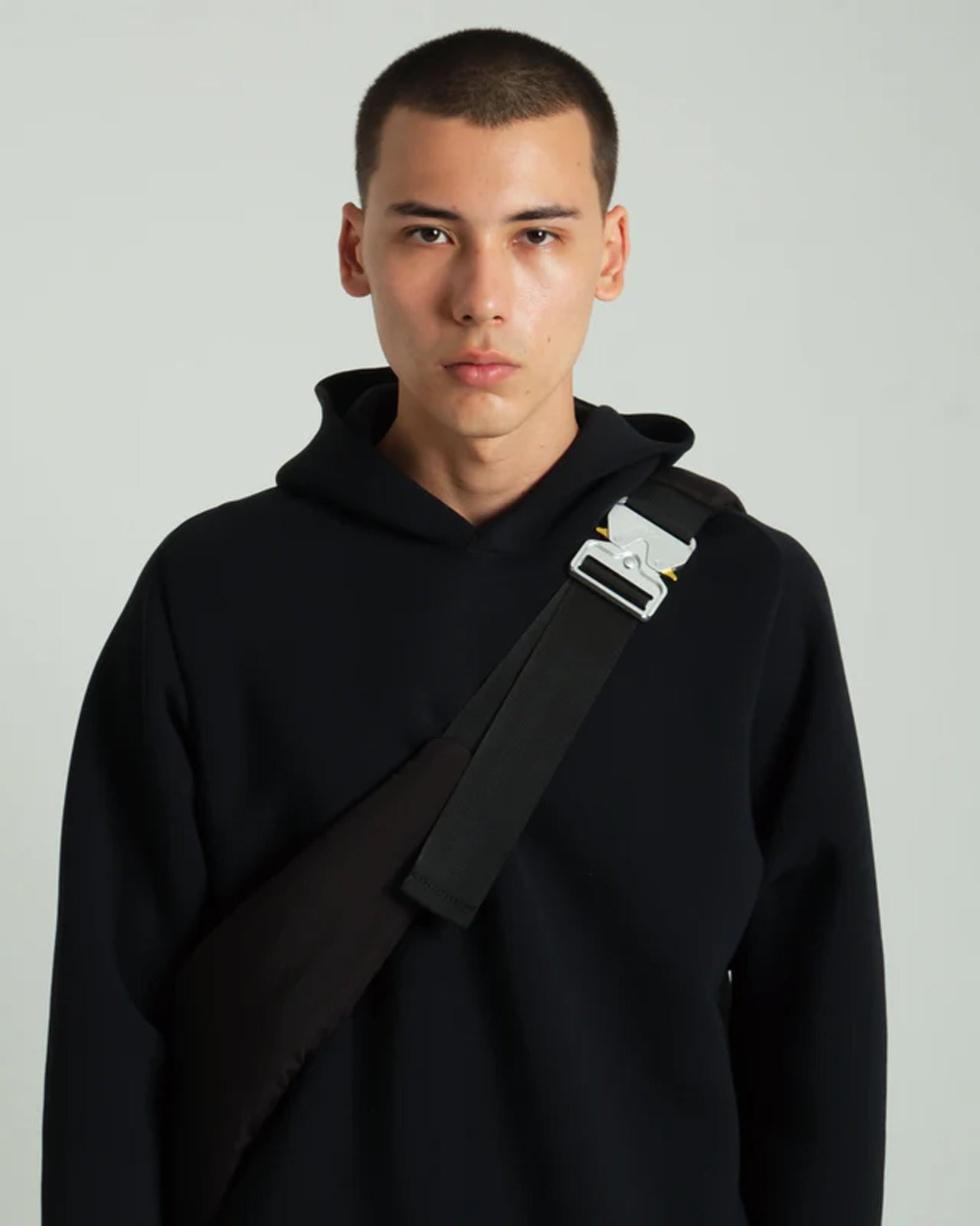 A Eckhaus Latta Shirt pictured on a model in front of a white background. The title of the product is Eckhaus Latta Eclipse Turtleneck - Stone and the image was taken by 199A®.