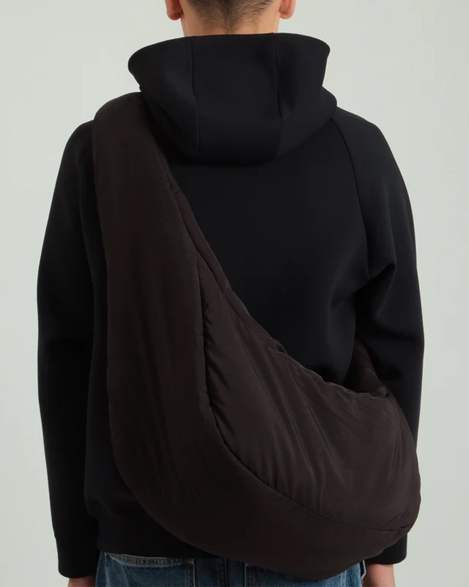 A Eckhaus Latta Shirt pictured on a model in front of a white background. The title of the product is Eckhaus Latta Eclipse Turtleneck - Stone and the image was taken by 199A®.