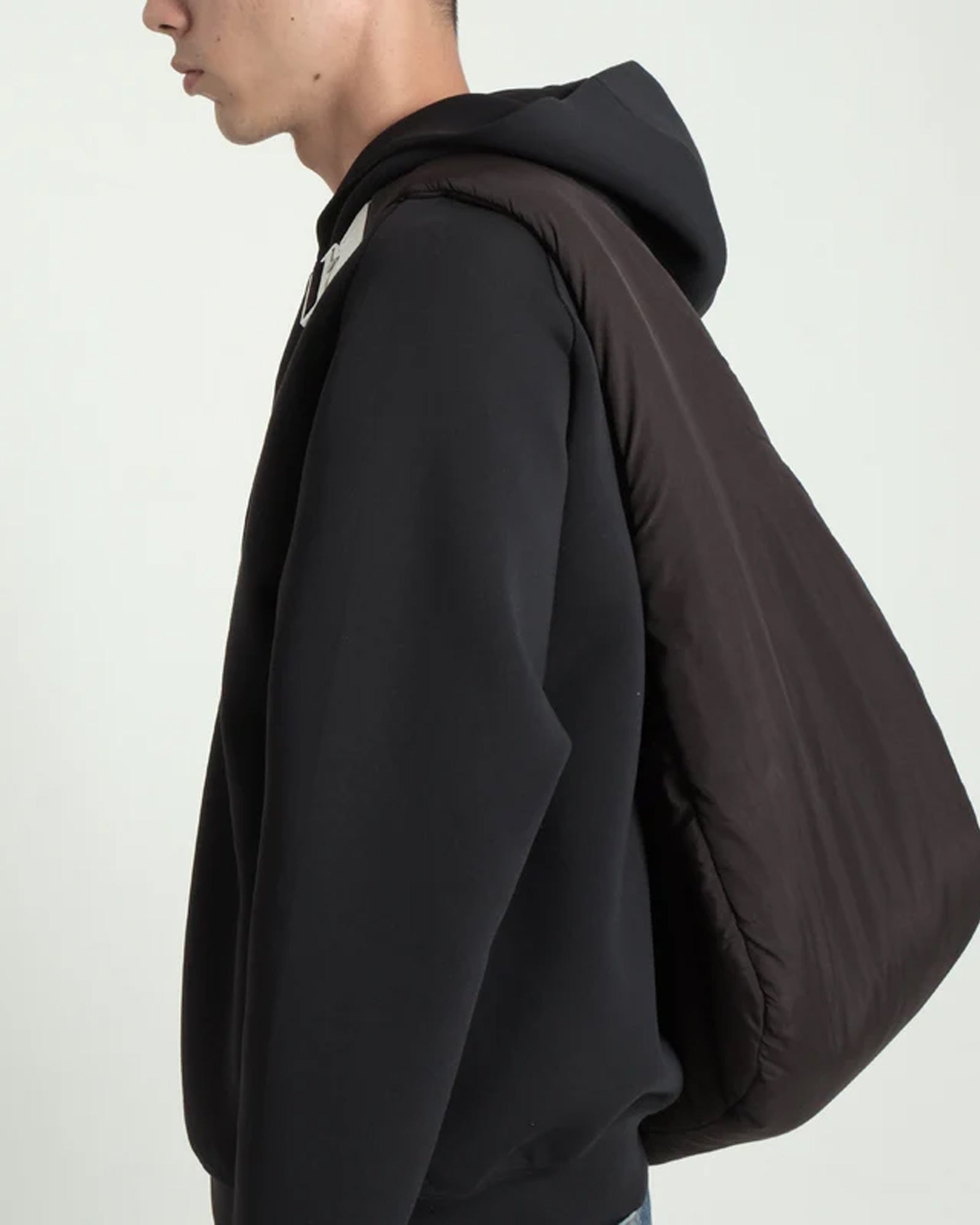 A Eckhaus Latta Shirt pictured on a model in front of a white background. The title of the product is Eckhaus Latta Eclipse Turtleneck - Stone and the image was taken by 199A®.