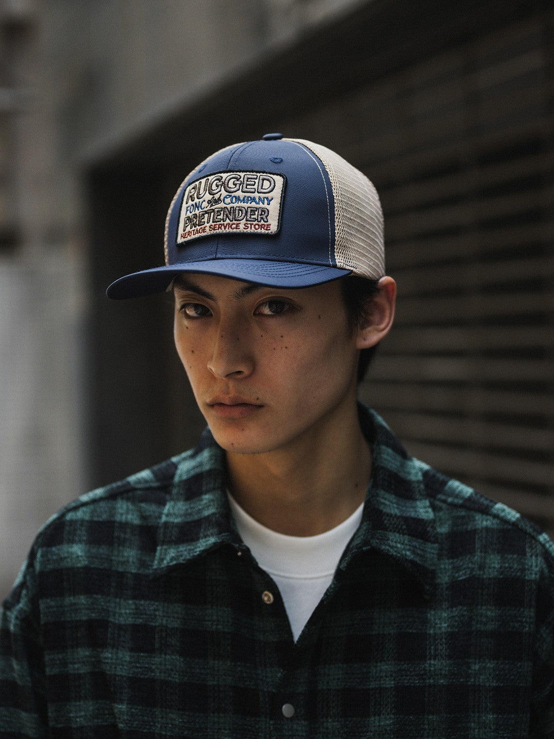 A Eckhaus Latta Shirt pictured on a model in front of a white background. The title of the product is Eckhaus Latta Eclipse Turtleneck - Stone and the image was taken by 199A®.