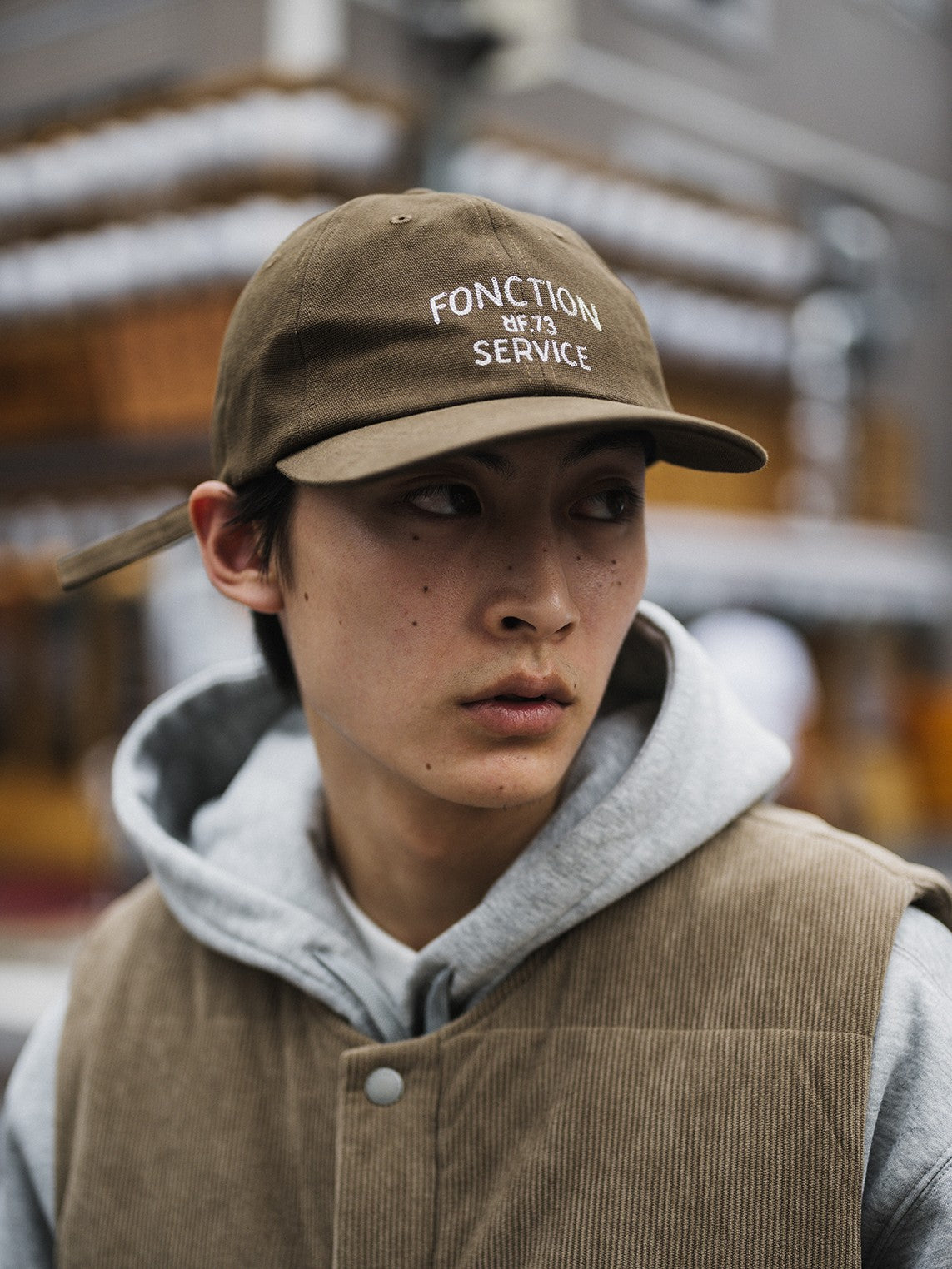 A Eckhaus Latta Shirt pictured on a model in front of a white background. The title of the product is Eckhaus Latta Eclipse Turtleneck - Stone and the image was taken by 199A®.