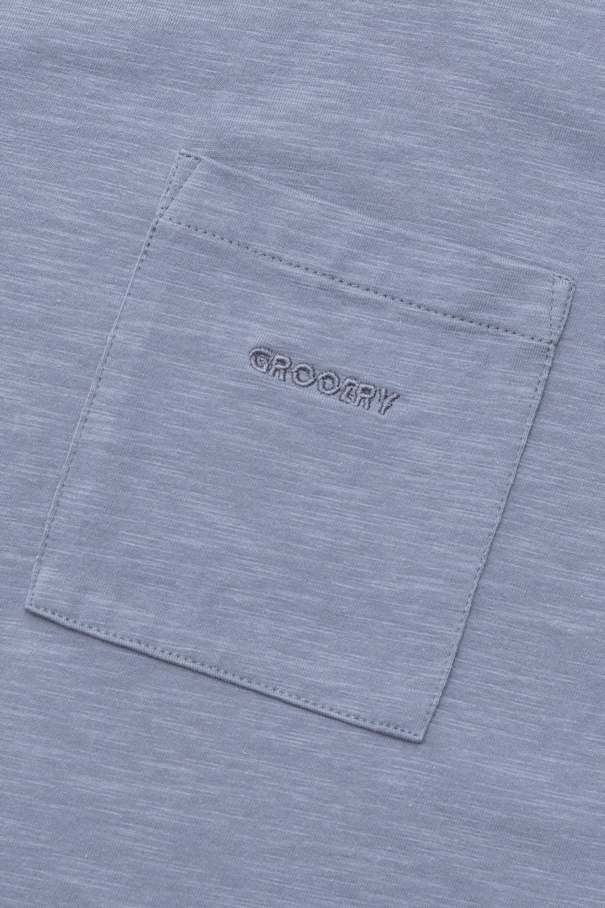 A Eckhaus Latta Shirt pictured on a model in front of a white background. The title of the product is Eckhaus Latta Eclipse Turtleneck - Stone and the image was taken by 199A®.