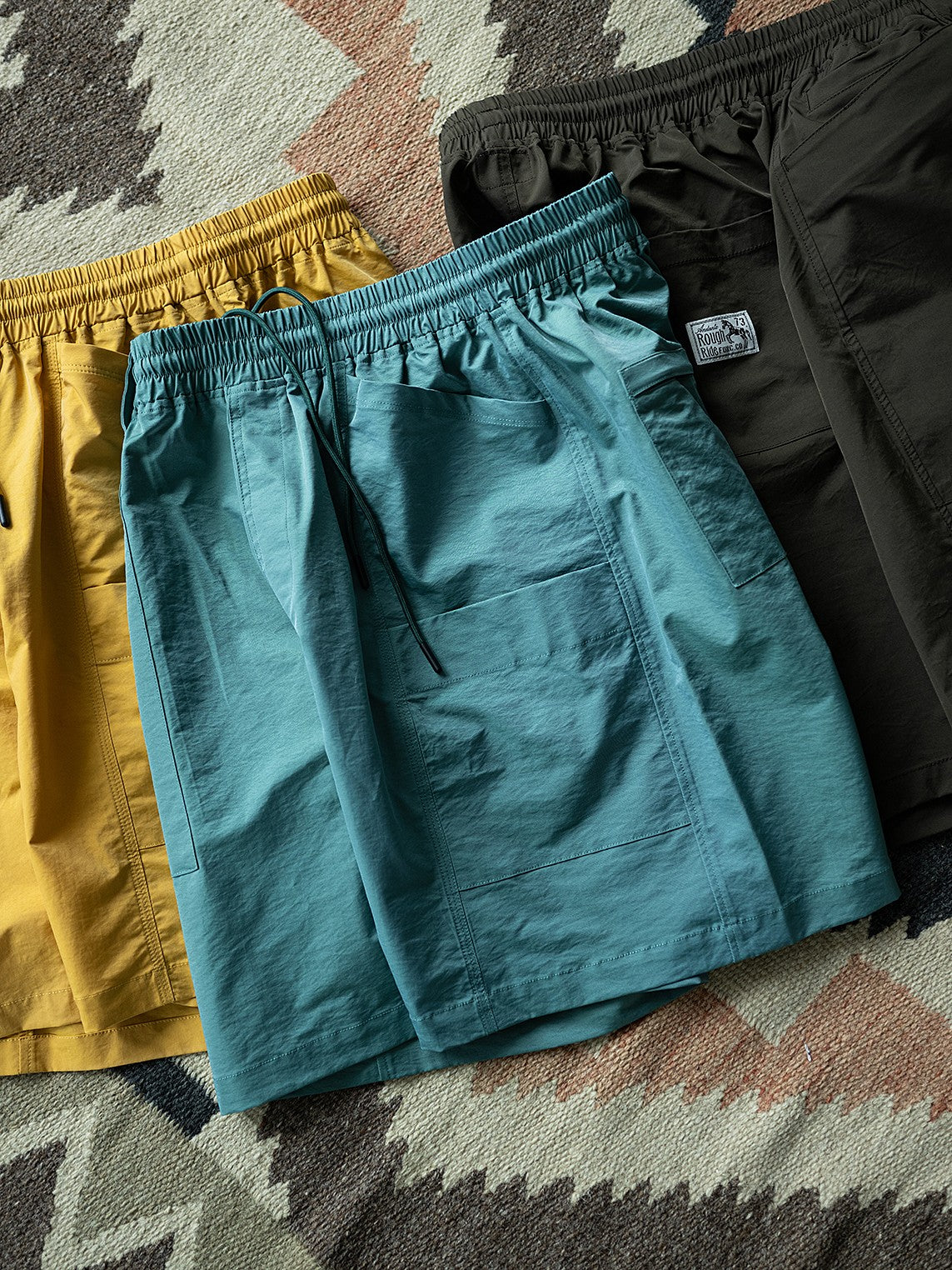 A Eckhaus Latta Shirt pictured on a model in front of a white background. The title of the product is Eckhaus Latta Eclipse Turtleneck - Stone and the image was taken by 199A®.