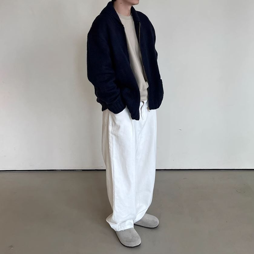 A Eckhaus Latta Shirt pictured on a model in front of a white background. The title of the product is Eckhaus Latta Eclipse Turtleneck - Stone and the image was taken by 199A®.
