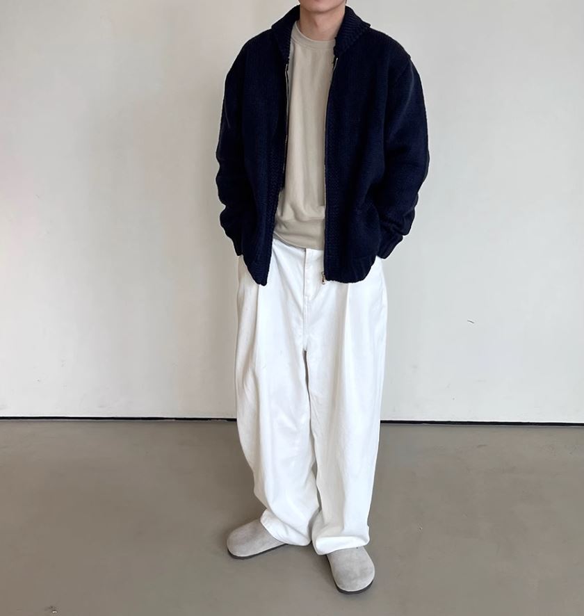 A Eckhaus Latta Shirt pictured on a model in front of a white background. The title of the product is Eckhaus Latta Eclipse Turtleneck - Stone and the image was taken by 199A®.